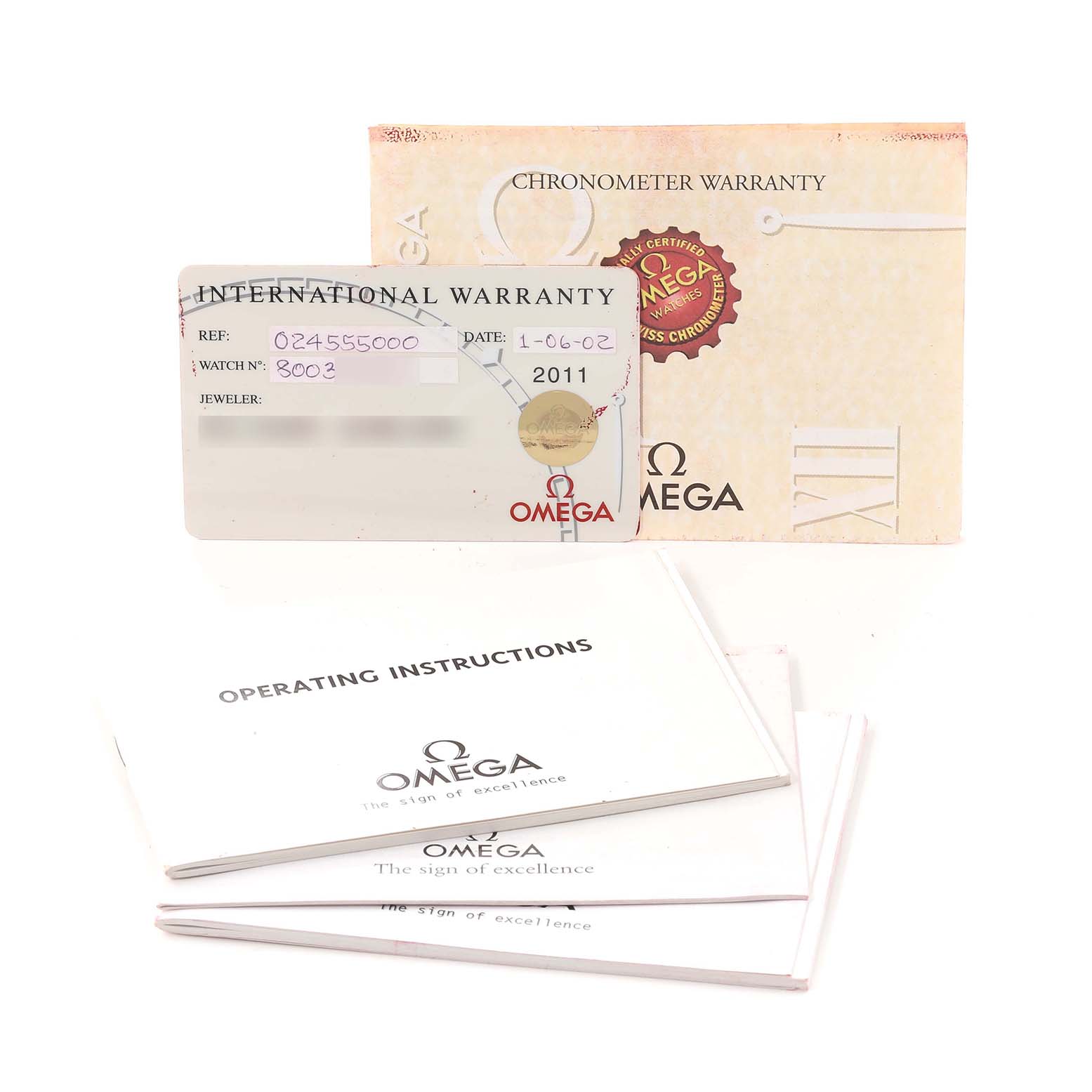 The image shows the warranty card, booklets, and instructions for an Omega Seamaster 2455.50.00 Men's Steel and Gold (two tone) Black Dial 2455.50.00 Men's Steel and Gold (two tone) Black Dial watch.