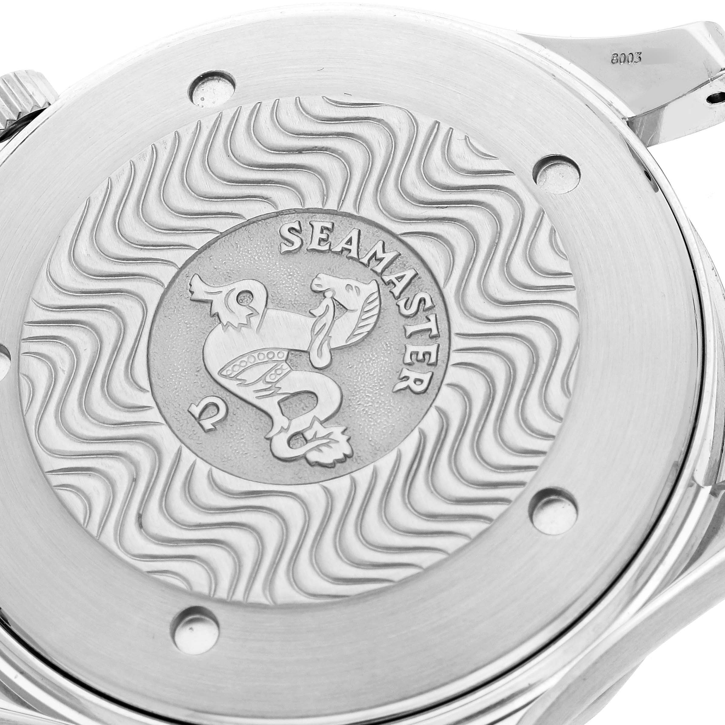 The image shows the engraved case back of an Omega Seamaster 2455.50.00 Men's Steel and Gold (two tone) Black Dial 2455.50.00 Men's Steel and Gold (two tone) Black Dial watch with a wavy pattern and seahorse emblem.