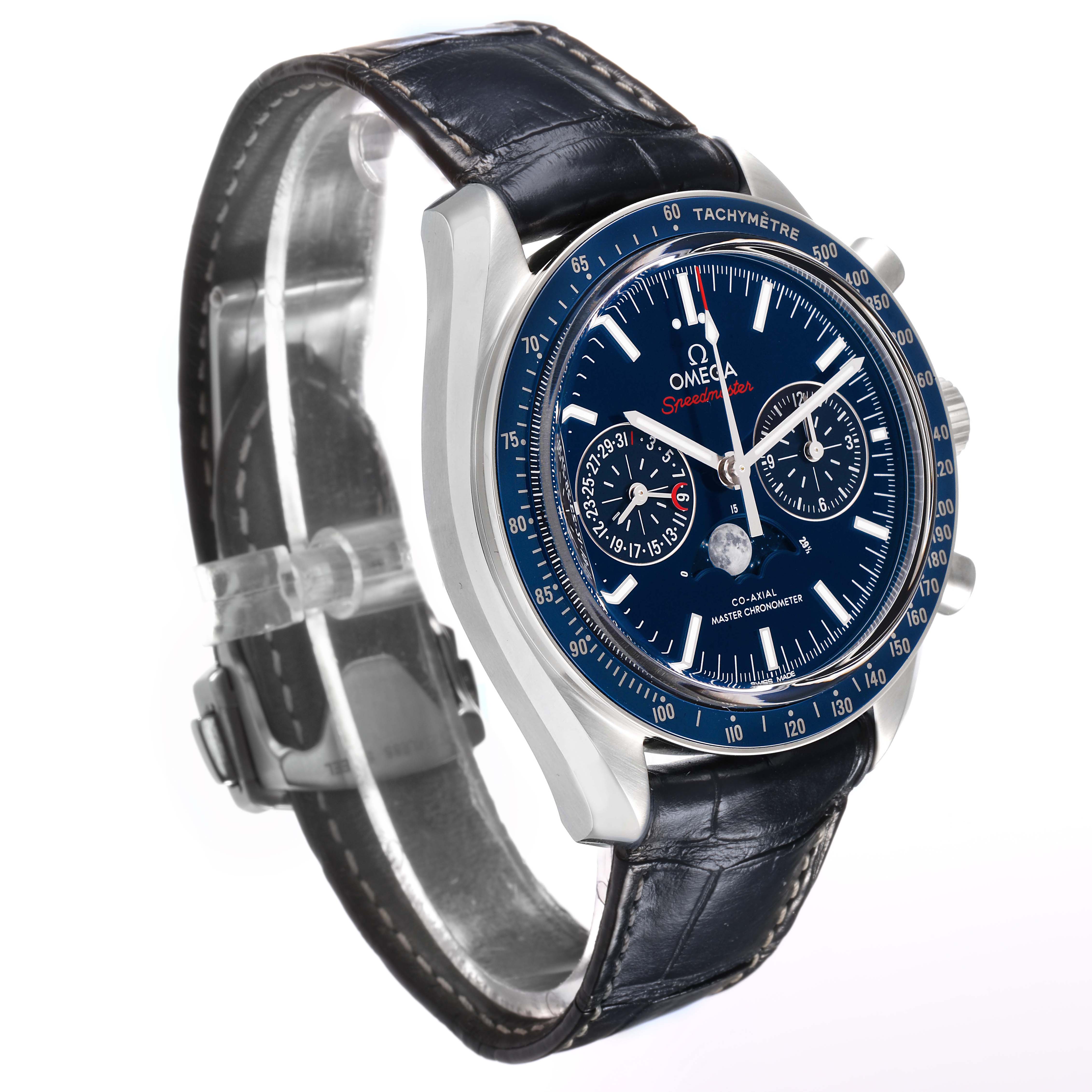 The Omega Speedmaster 304.33.44.52.03.001 Men's Stainless Steel Blue Dial watch is shown at an angle highlighting the face, side chronographs, and leather strap.