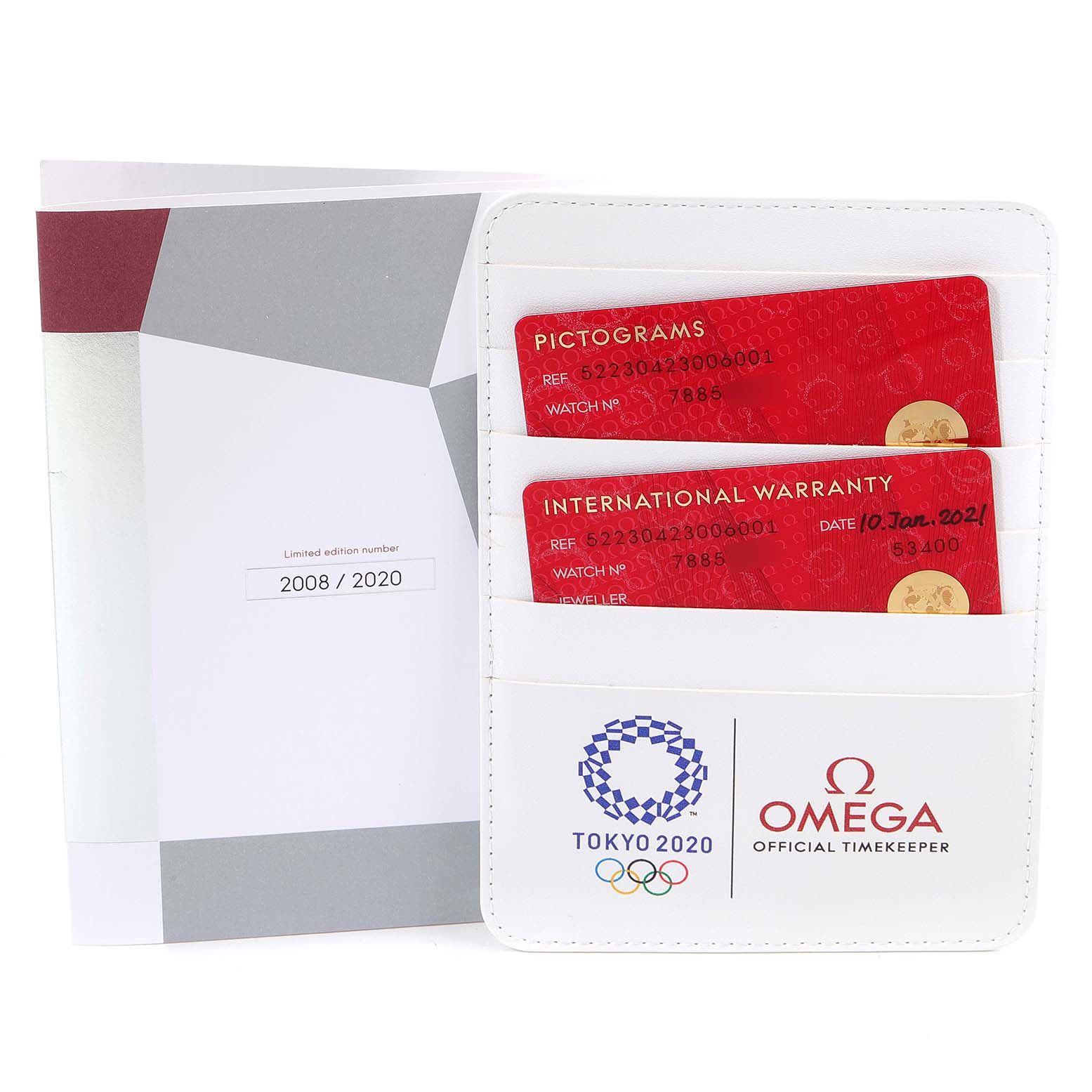 The image shows a warranty card and pictograms card, along with a booklet for the Omega Speedmaster 522.30.42.30.06.001 Men's Stainless Steel Silver Dial 522.30.42.30.06.001 Men's Stainless Steel Silver Dial, commemorating Tokyo 2020 Olympics.