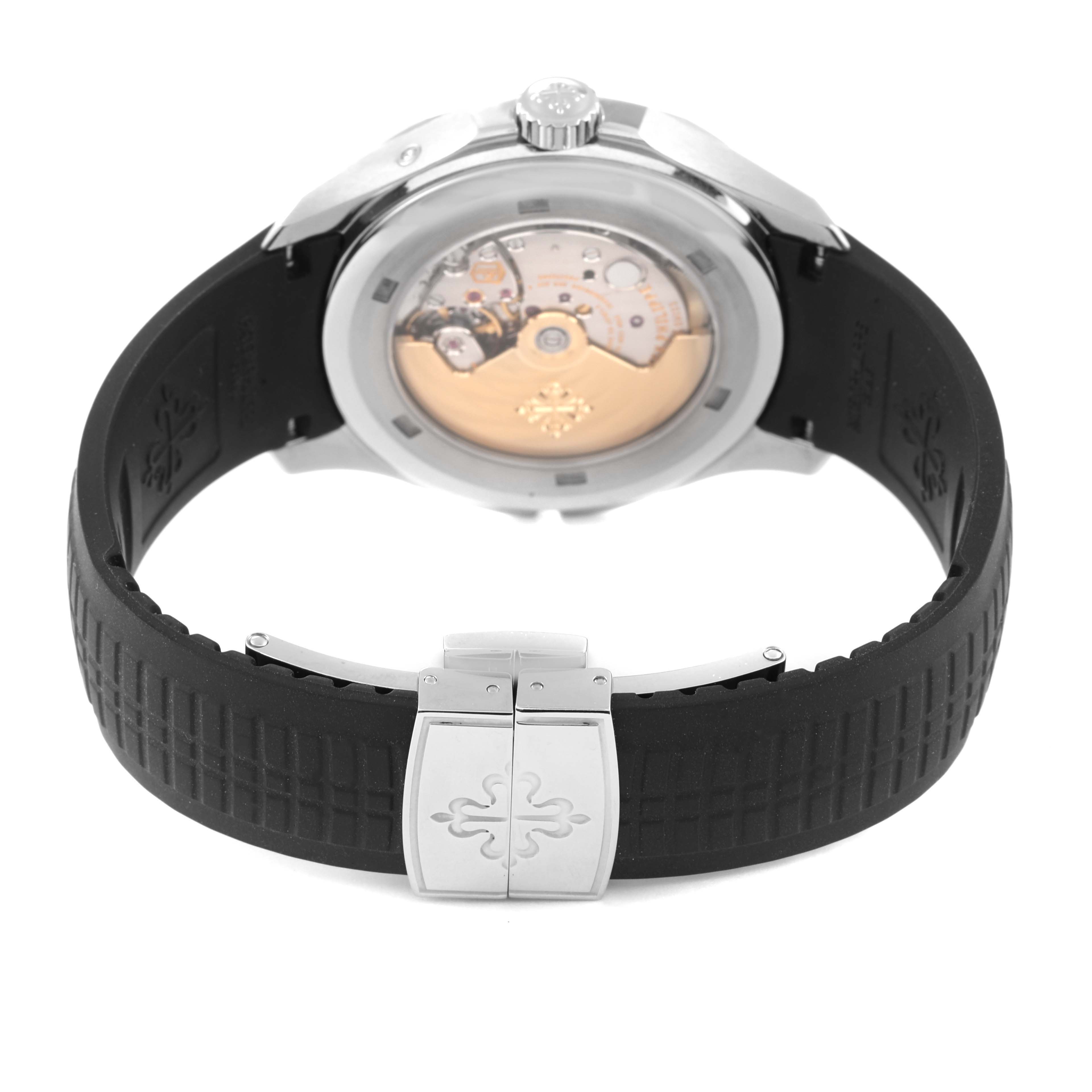 The image shows the back view of a Patek Philippe Aquanaut 5164A Men's Stainless Steel Black Dial 5164A Men's Stainless Steel Black Dial watch, highlighting the movement and the rubber strap with clasp.