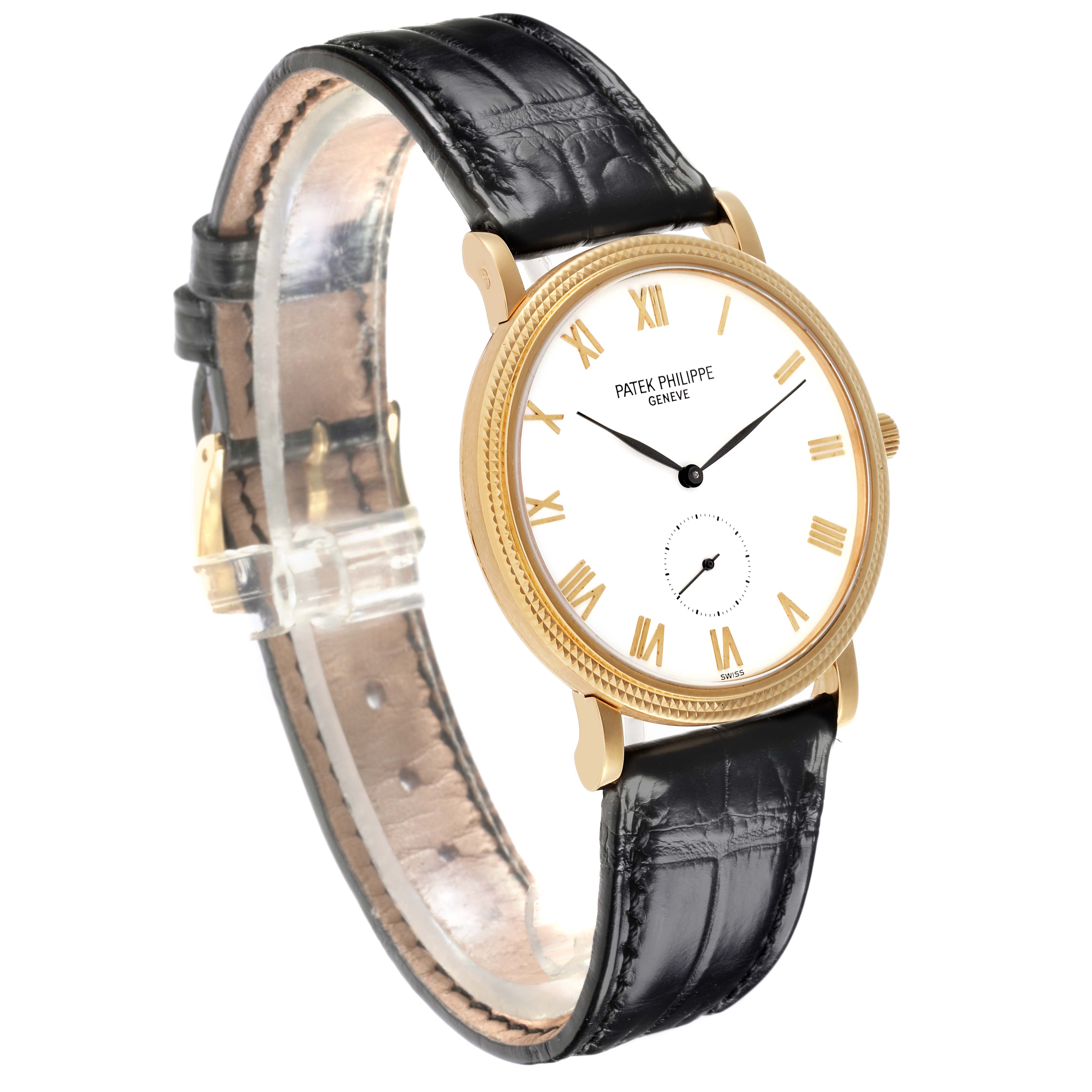The Patek Philippe Calatrava 3919J Men's Yellow Gold White Dial 3919J Men's Yellow Gold White Dial watch is shown at a slight angle, displaying the face, gold bezel, and black leather strap.