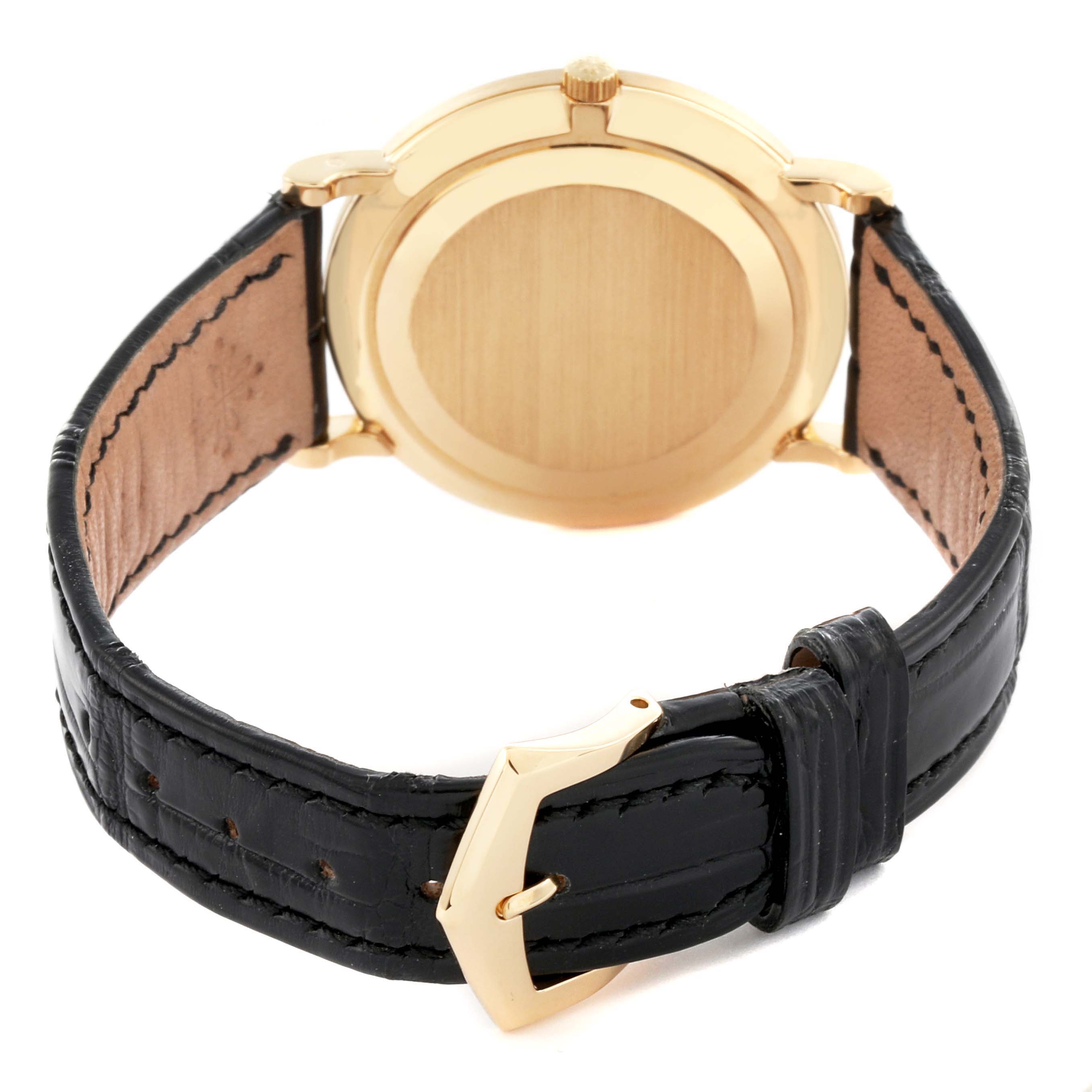 The image shows the back case and leather strap of a Patek Philippe Calatrava 3919J Men's Yellow Gold White Dial 3919J Men's Yellow Gold White Dial watch from a rear angle.