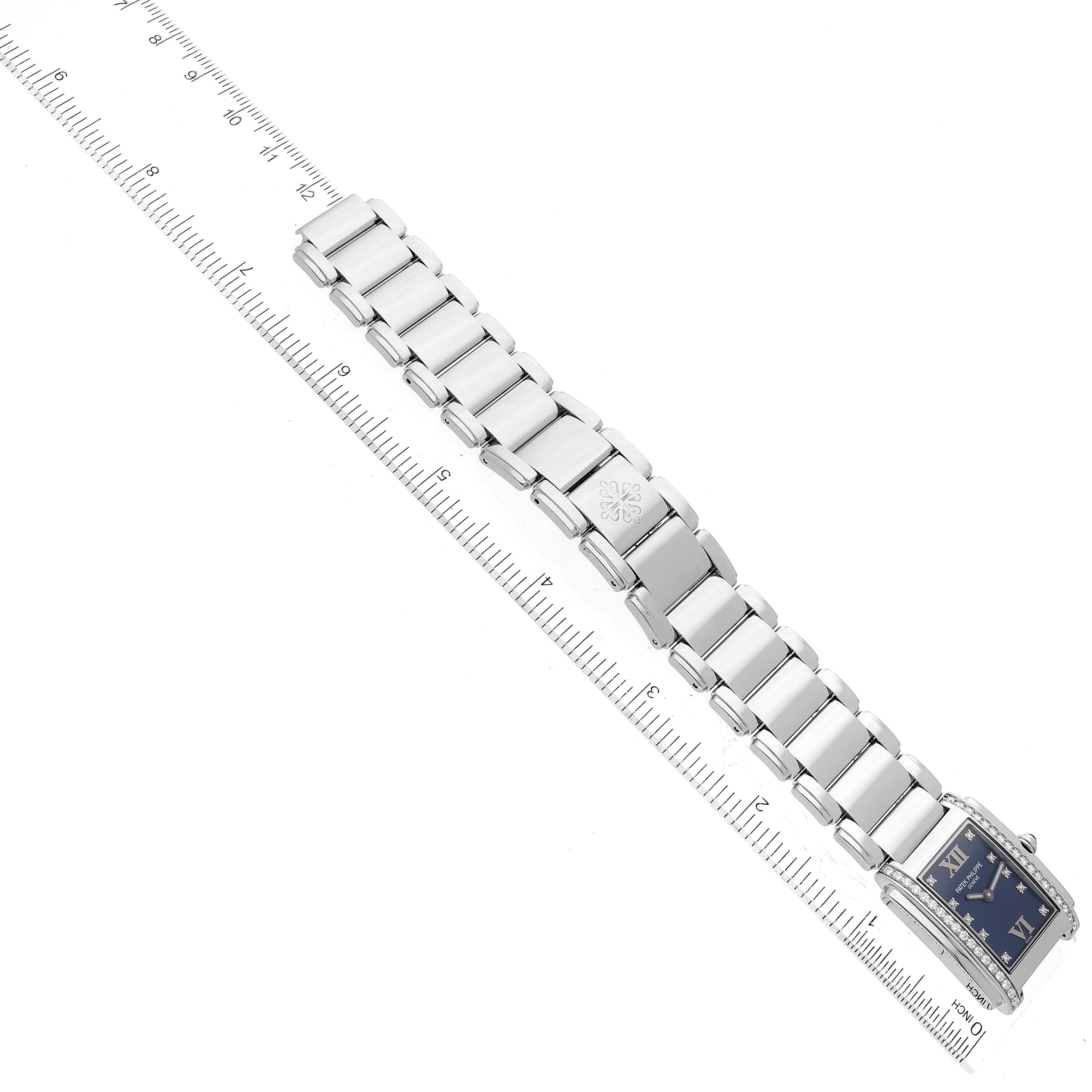 The image shows a top-down view of a Patek Philippe Twenty-4 4910/10A-012 Women's Stainless Steel Blue Dial 4910/10A-012 Women's Stainless Steel Blue Dial model watch, highlighting its bracelet and part of the dial.