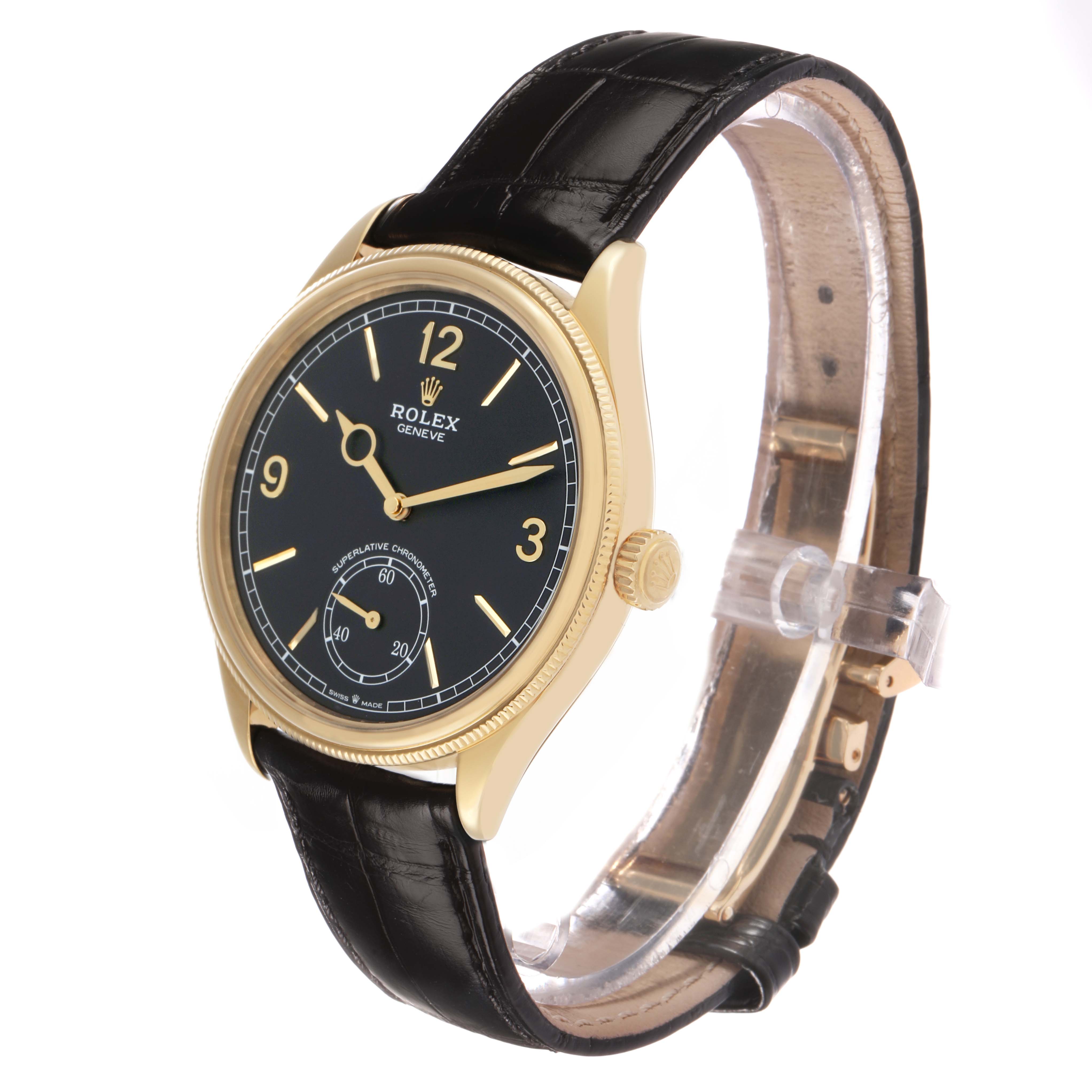 The Rolex 1908 52508 Men's Yellow Gold Black Dial watch is shown at a three-quarter angle, highlighting the dial, case, crown, and leather strap.