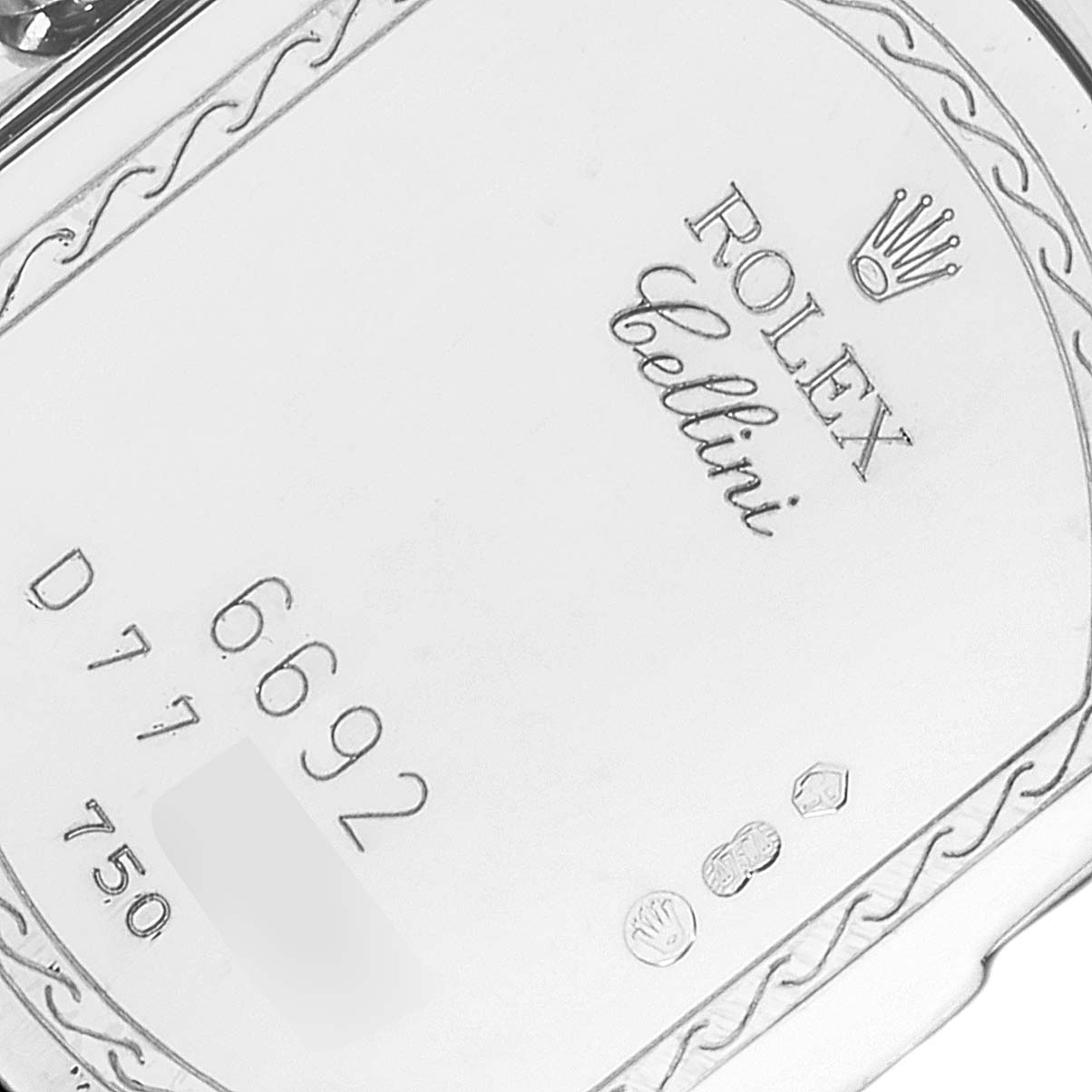 The image shows a close-up of the back case of a Rolex Cellini 6692 Women's White Gold White Dial 6692 Women's White Gold White Dial watch, displaying the model number and brand engravings.