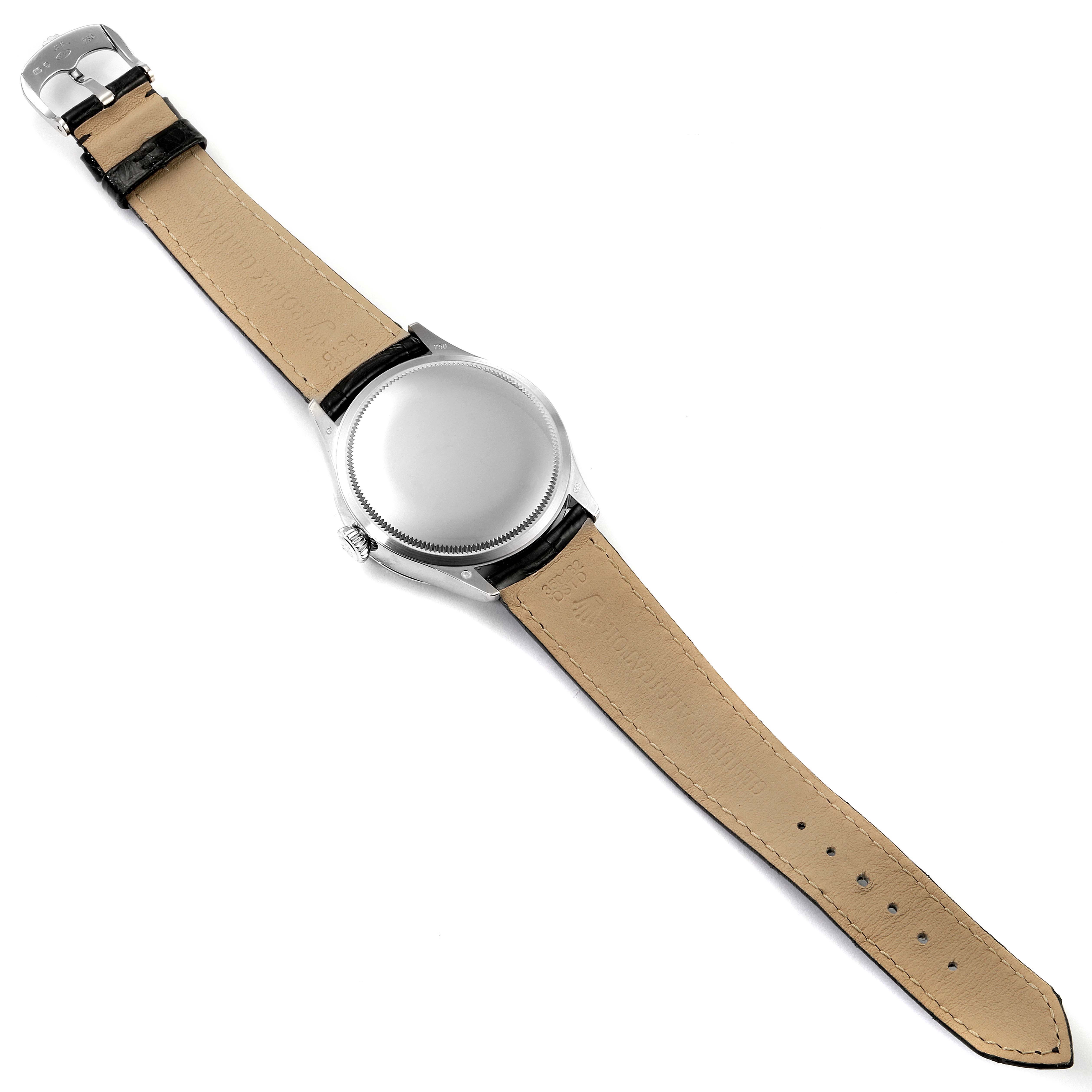 The image shows the back of a Rolex Cellini 50519 Men's White Gold Black Dial 50519 Men's White Gold Black Dial watch, featuring its leather strap and case back, from a top-down angle.