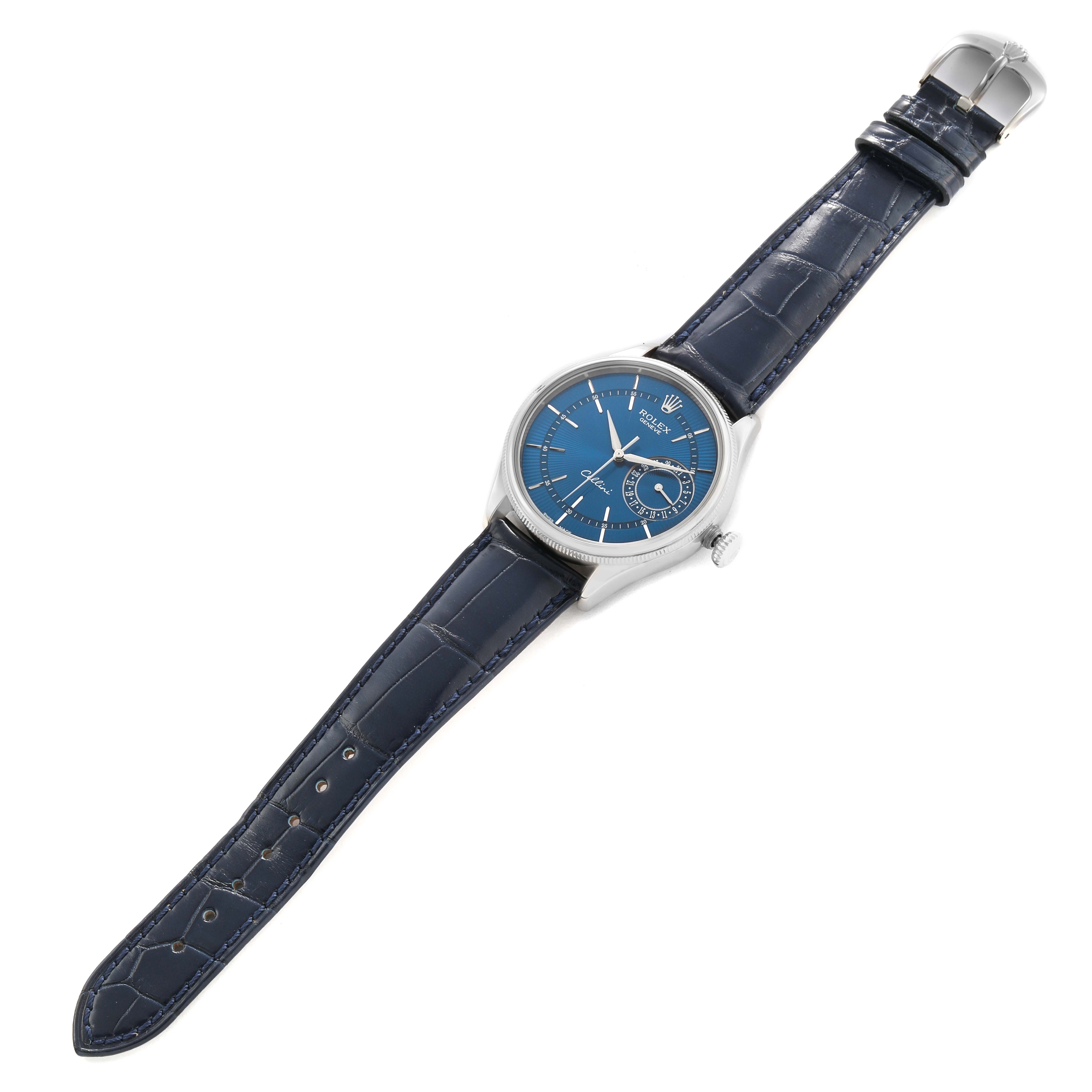The Rolex Cellini 50519 Men's White Gold Blue Dial watch is shown from a top-down angle, displaying the blue dial, case, lugs, strap, and clasp.