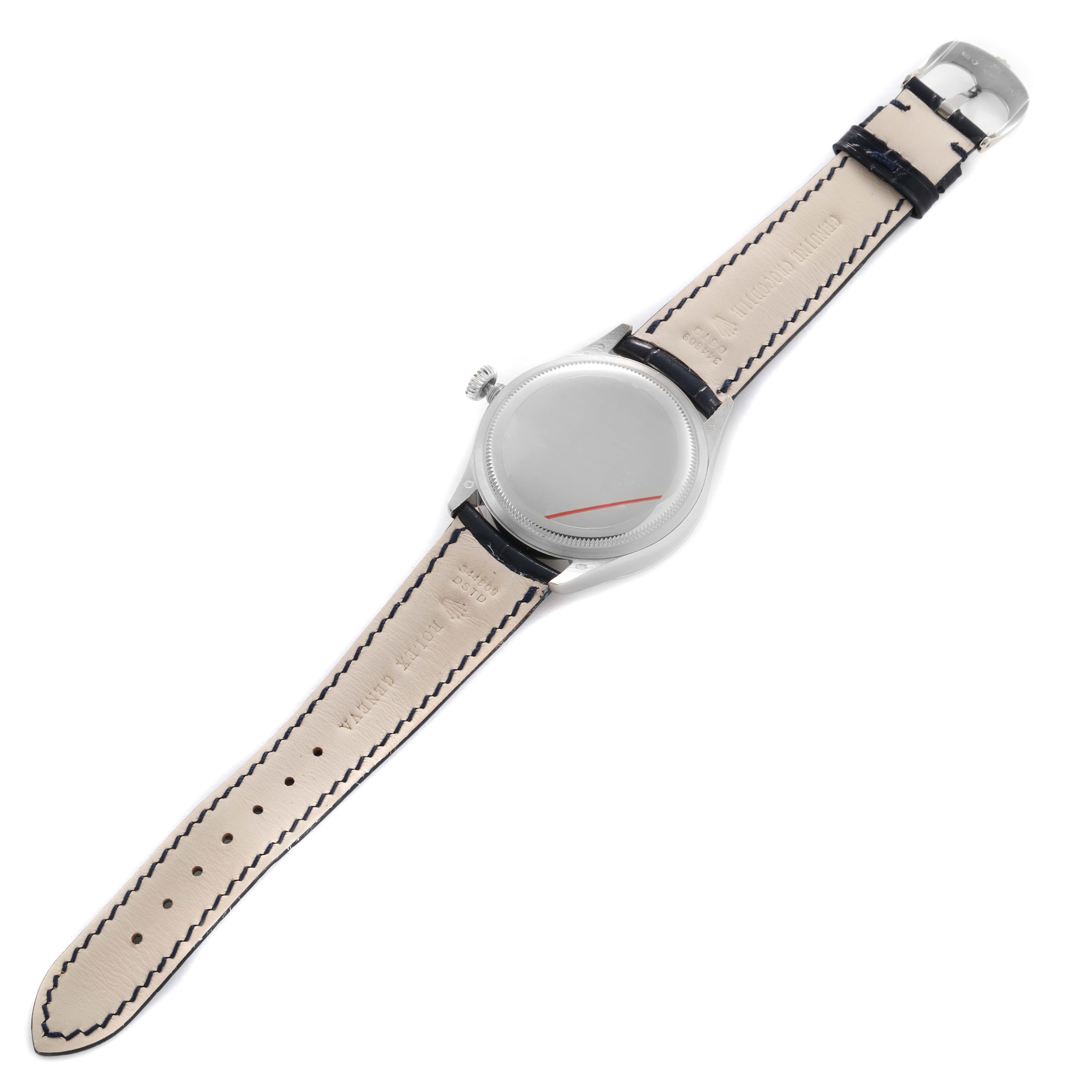 The image shows the back view of the Rolex Cellini 50519 Men's White Gold Blue Dial watch, highlighting its leather strap and clasp.