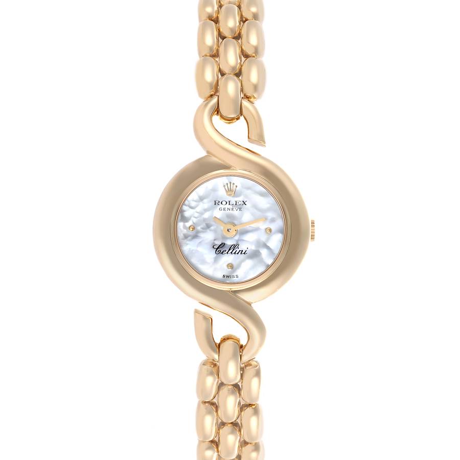 The Rolex Cellini watch is shown from the front, featuring its round face and gold bracelet.