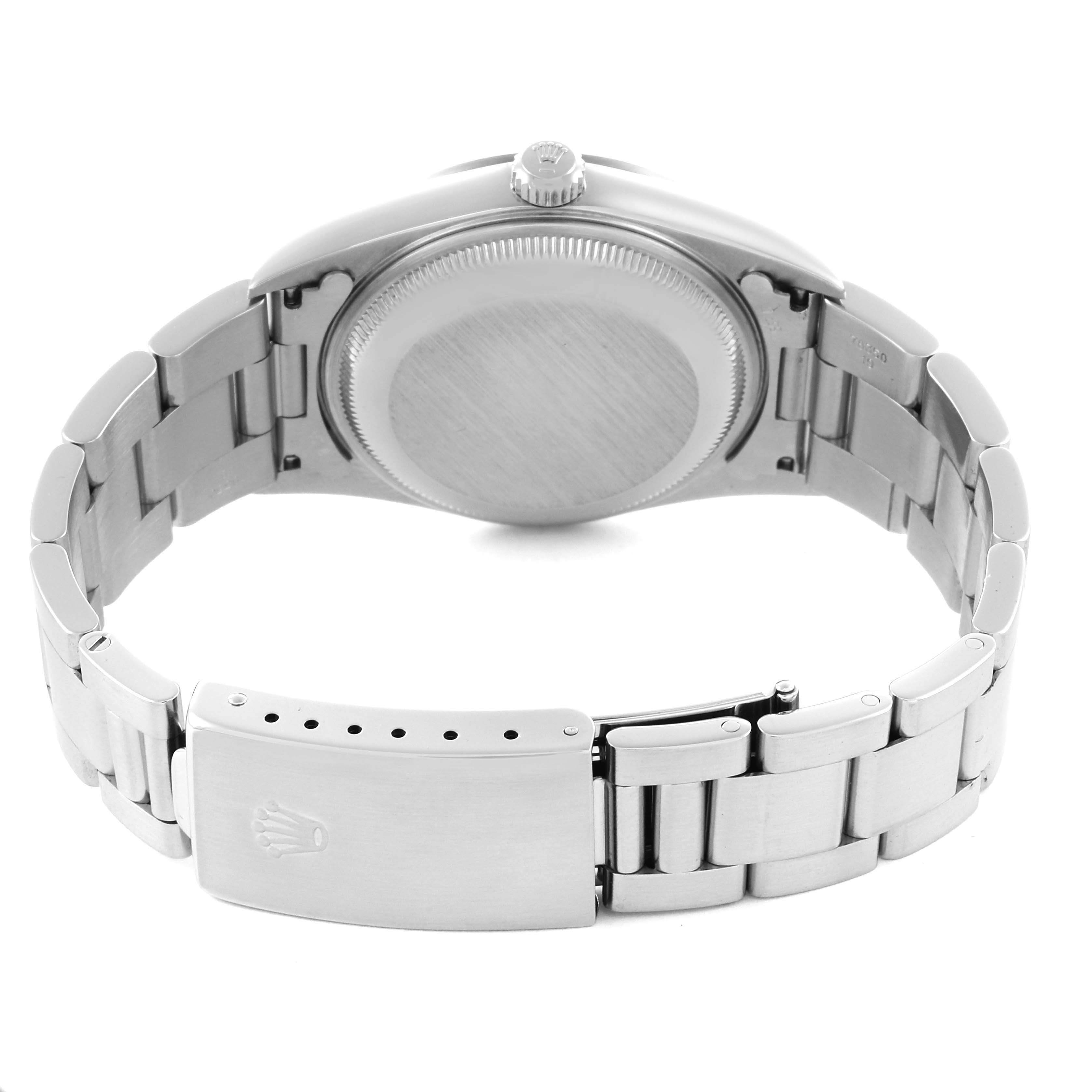 The image shows the back case, crown, and bracelet clasp of a Rolex Date 15200 Men's Stainless Steel Pink Dial 15200 Men's Stainless Steel Pink Dial model watch from a rear angle.