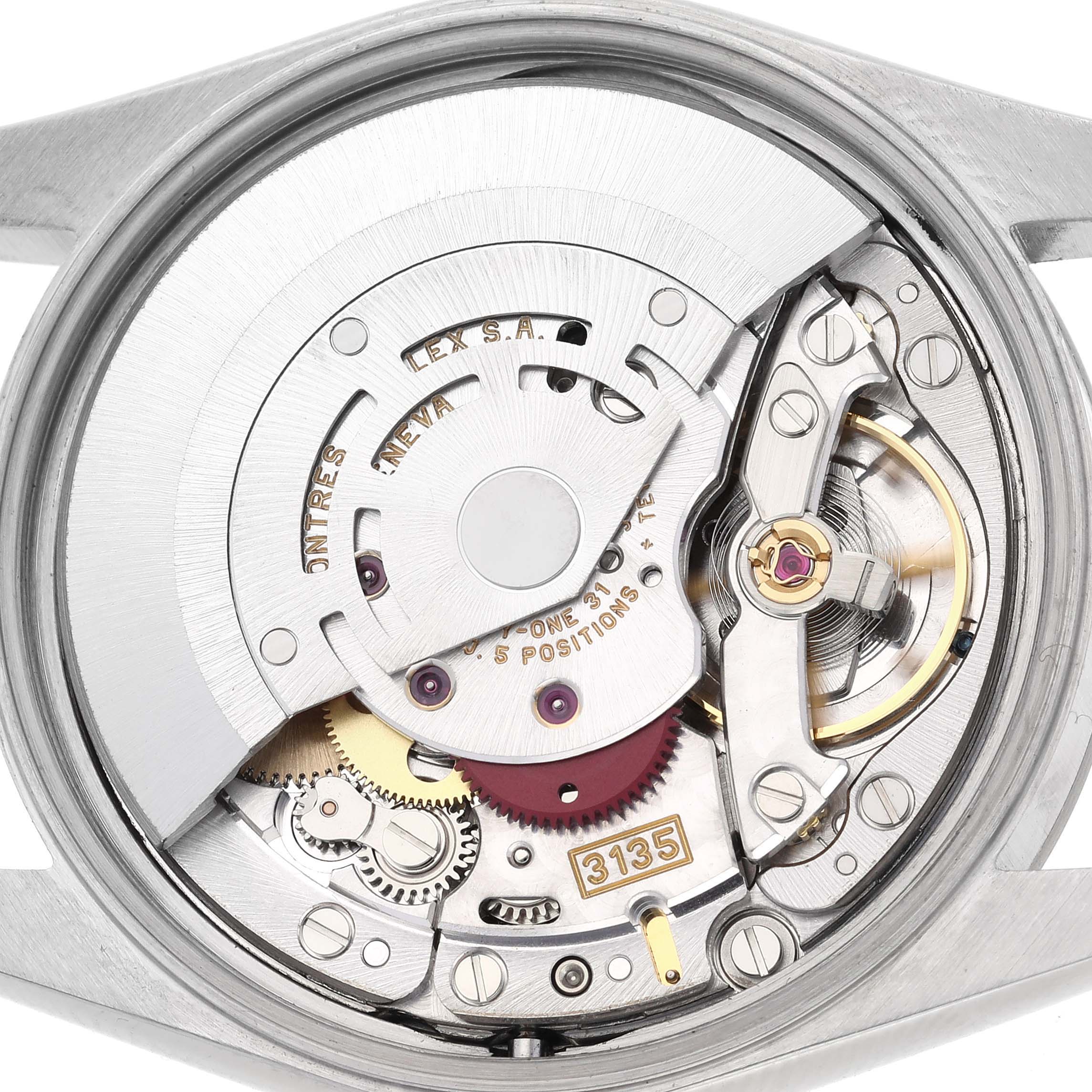 The image shows the movement (Caliber 3135) of a Rolex Date 15200 Men's Stainless Steel Pink Dial 15200 Men's Stainless Steel Pink Dial watch from a top-down angle, highlighting the intricate mechanics.