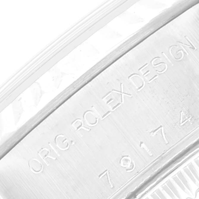 This close-up image shows the engraving on the case side of a Rolex Datejust 79174 Women's Stainless Steel Silver Dial 79174 Women's Stainless Steel Silver Dial watch.
