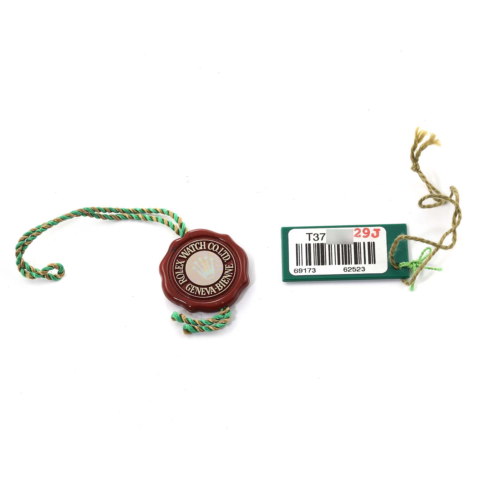 This image shows the authenticity tag and barcode tag for a Rolex Datejust 69173 Women's Steel and Gold (two tone) Black Dial 69173 Women's Steel and Gold (two tone) Black Dial watch.