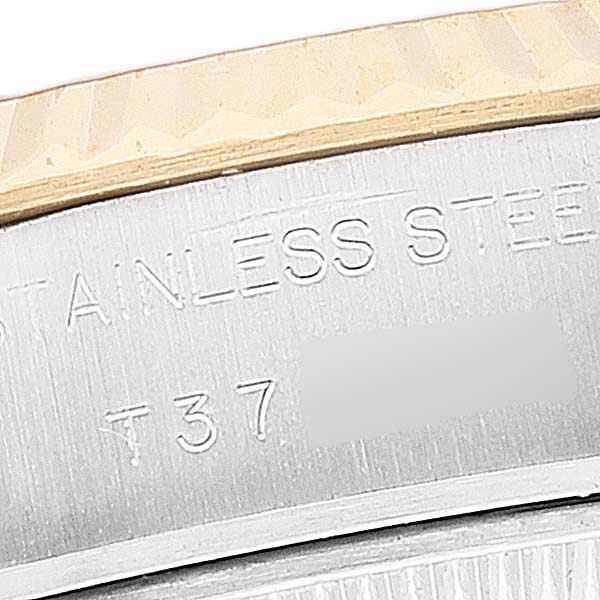 Close-up angle showing the "Stainless Steel" engraving and part of the bezel on a Rolex Datejust 69173 Women's Steel and Gold (two tone) Black Dial 69173 Women's Steel and Gold (two tone) Black Dial watch.