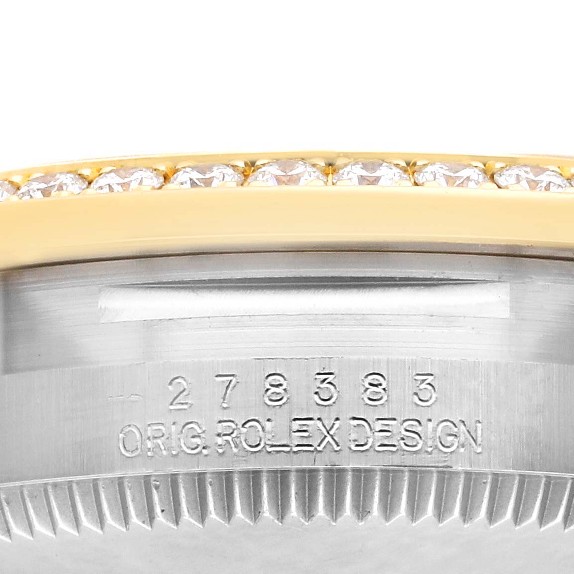 The image shows a side view of a Rolex Mid-Size 278383RBR Women's Steel and Gold (two tone) Champagne Dial 278383RBR Women's Steel and Gold (two tone) Champagne Dial watch focusing on the bezel with diamonds and part of the case.