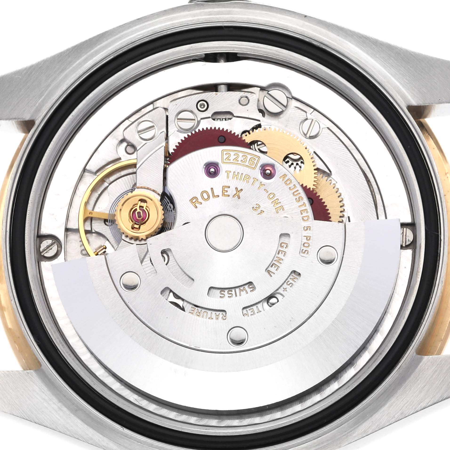The image shows the movement of a Rolex Mid-Size 278383RBR Women's Steel and Gold (two tone) Champagne Dial 278383RBR Women's Steel and Gold (two tone) Champagne Dial watch with visible gears and Rolex markings, viewed from the back.