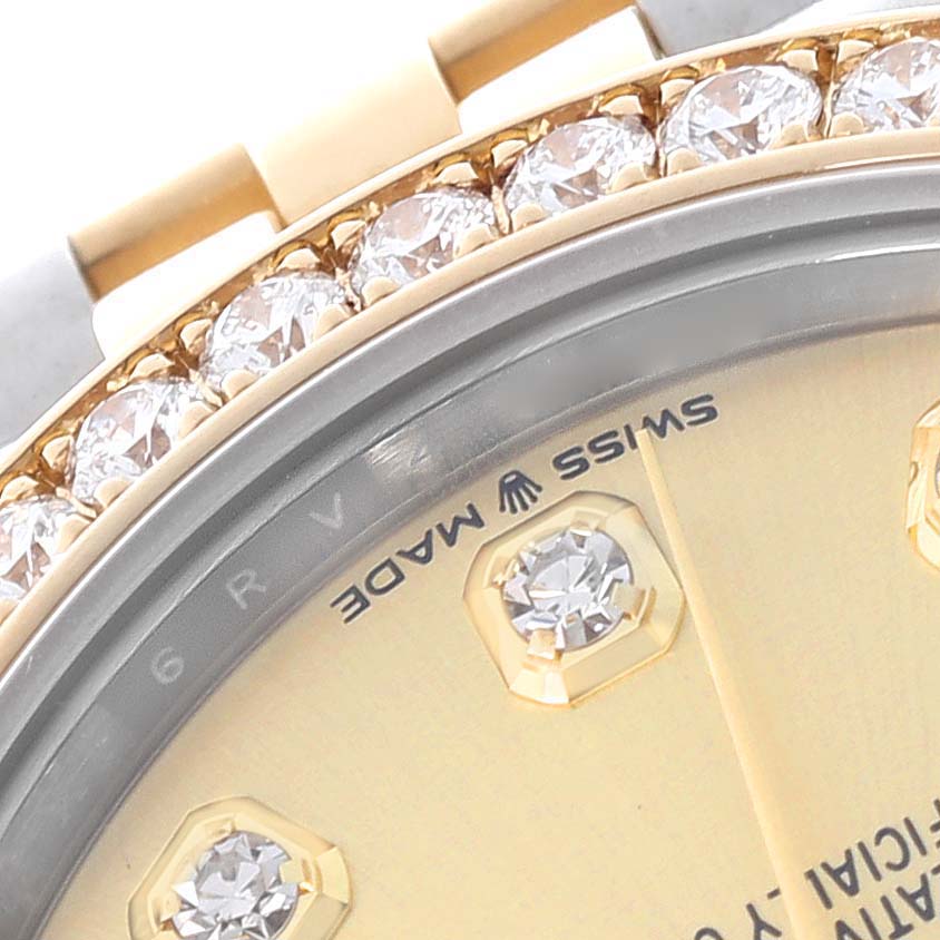 The image shows a close-up of the bezel and dial of a Rolex Mid-Size 278383RBR Women's Steel and Gold (two tone) Champagne Dial 278383RBR Women's Steel and Gold (two tone) Champagne Dial watch, highlighting diamond details.