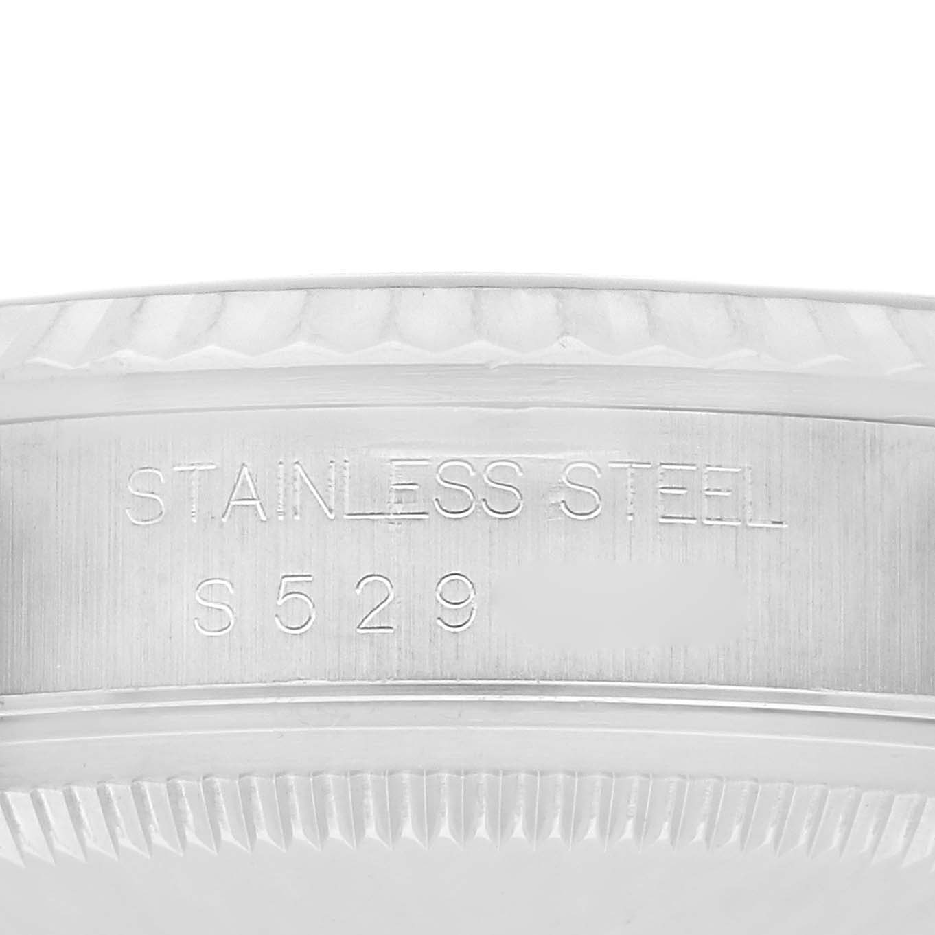 The image shows a close-up of the engraved stainless steel watch bezel of the Rolex Datejust 16234 Men
s Stainless Steel Silver Dial 16234 Men
s Stainless Steel Silver Dial.