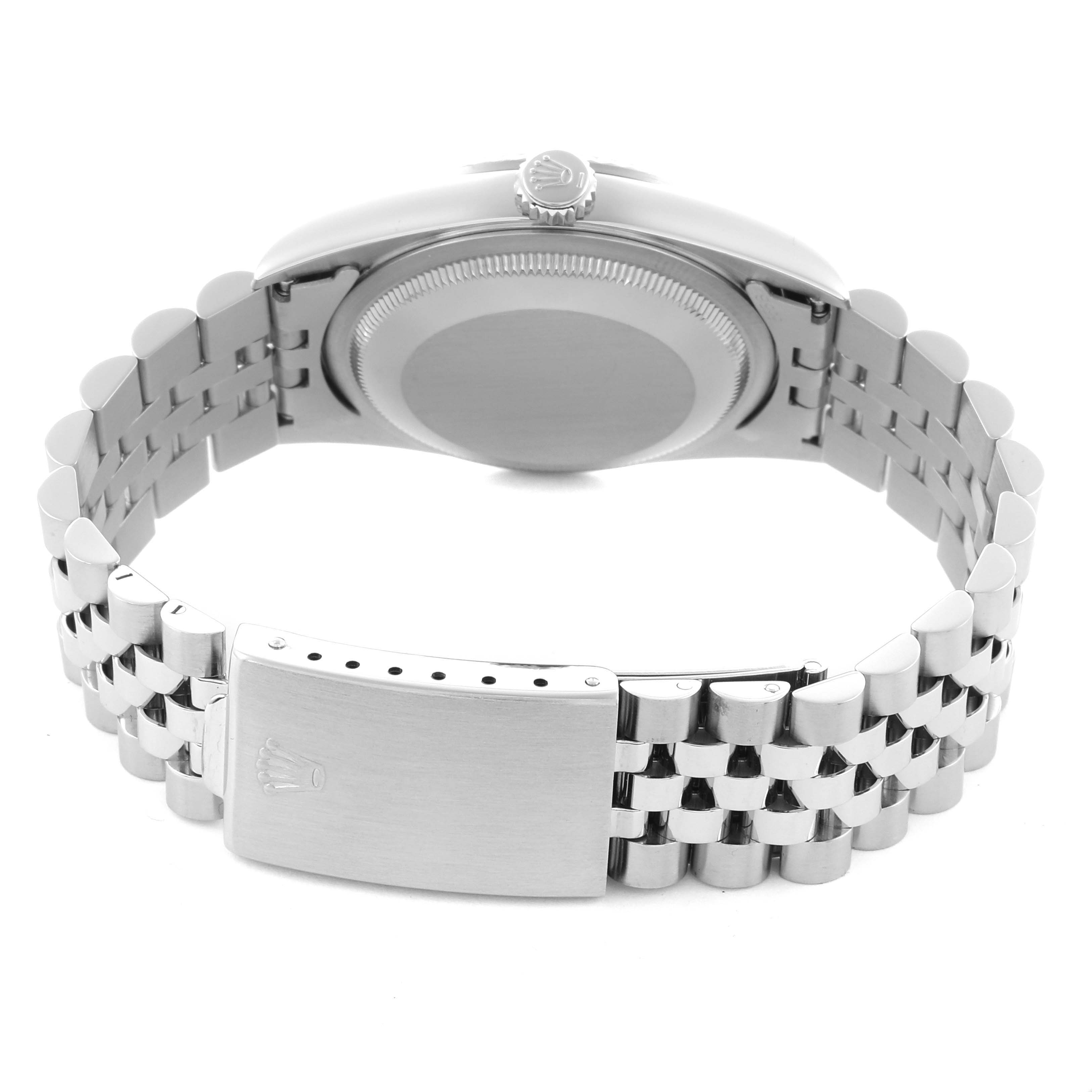 The Rolex Datejust 16234 Men
s Stainless Steel Silver Dial 16234 Men
s Stainless Steel Silver Dial watch is shown from the back, highlighting its case back and bracelet clasp.