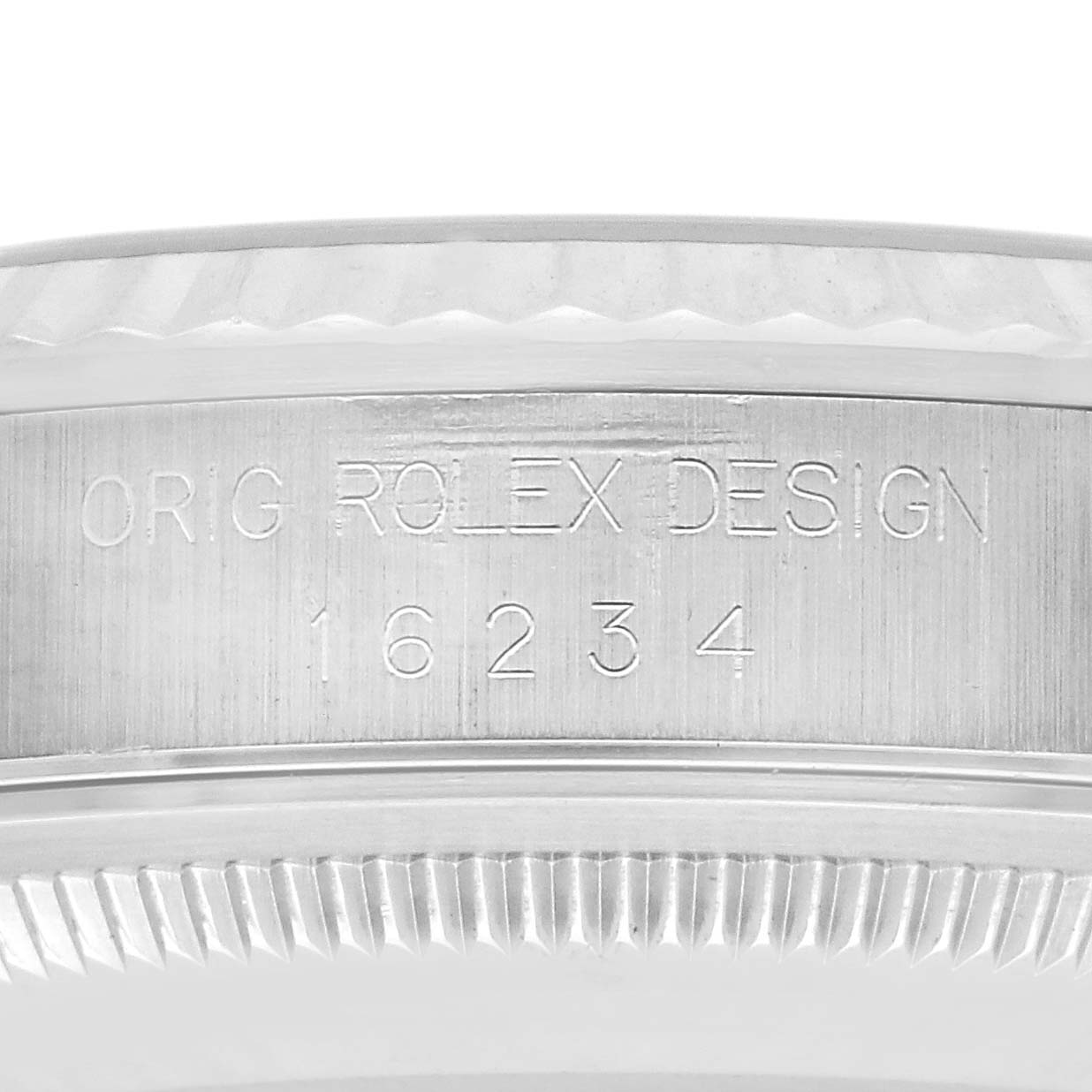 The image shows the side view of a Rolex Datejust 16234 Men
s Stainless Steel Silver Dial 16234 Men
s Stainless Steel Silver Dial case with engraved model number "16234" and "ORIG ROLEX DESIGN."