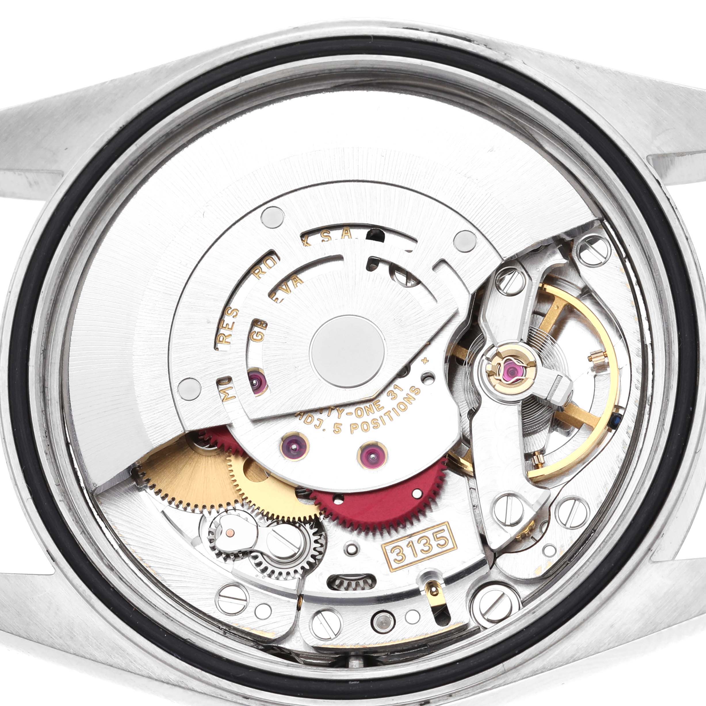 The image shows the movement mechanism of a Rolex Datejust 16200 Men's Stainless Steel White Dial 16200 Men's Stainless Steel White Dial watch from a rear angle, highlighting gears and components.