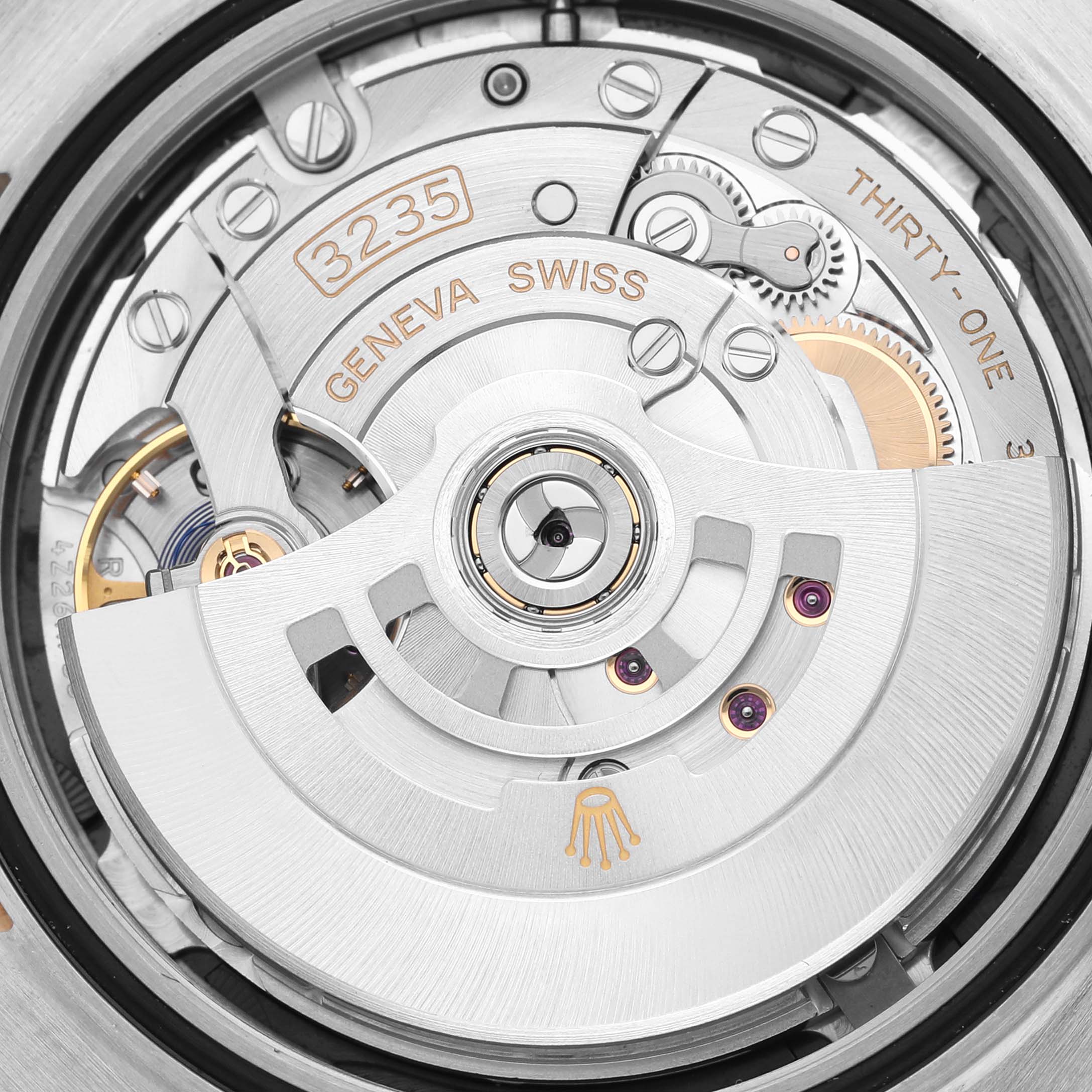 The image shows the intricate movement mechanism of the Rolex Datejust 41 126333 Men
s Steel and Gold (two tone) Black Dial 126333 Men
s Steel and Gold (two tone) Black Dial, highlighting its inner components.