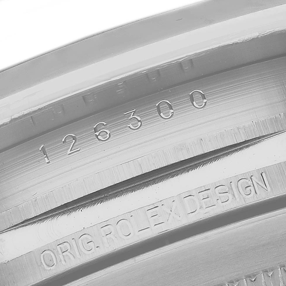 The image shows a detailed view of the Rolex Datejust 41 67197 Men's Stainless Steel Grey Dial 67197 Men's Stainless Steel Grey Dial model's inside rim with engraving.