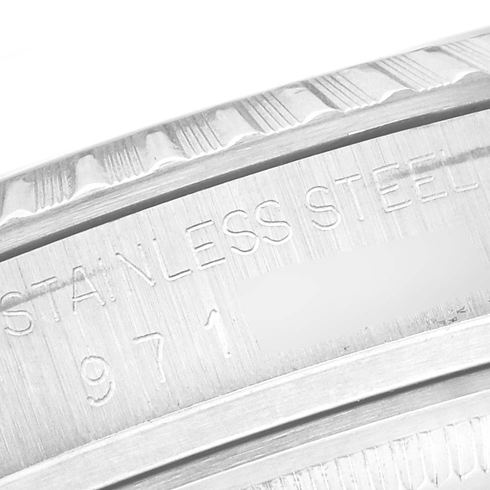 The image shows a close-up of the engraved bezel and inner ring of a Rolex Datejust 16030 Men
s Stainless Steel Silver Dial 16030 Men
s Stainless Steel Silver Dial watch.