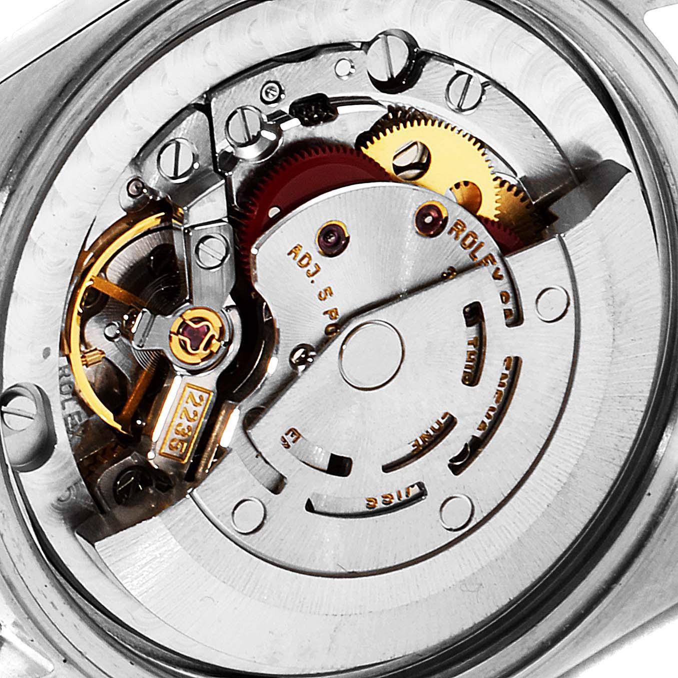 This close-up image shows the inner mechanical movement of a Mid-Size Rolex watch from the back.