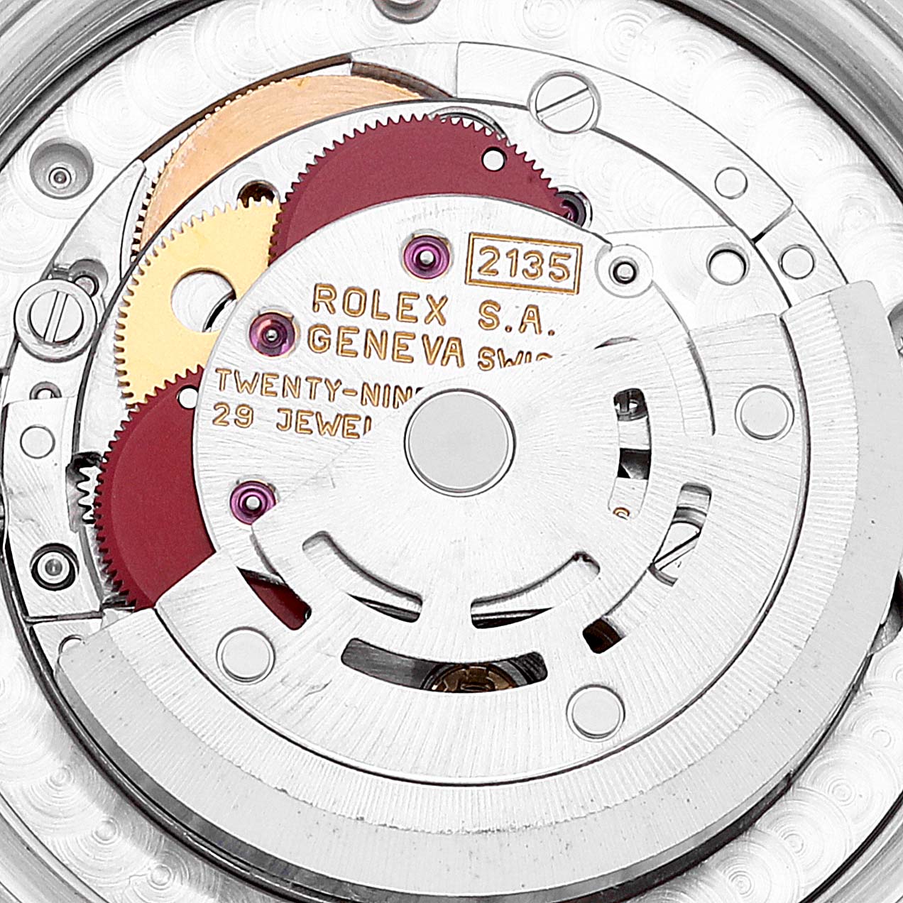 This image shows a close-up view of the internal mechanism of a Rolex Mid-Size 68273 Women
s Steel and Gold (two tone) Champagne Dial 68273 Women
s Steel and Gold (two tone) Champagne Dial model watch, displaying its gears and jewels.