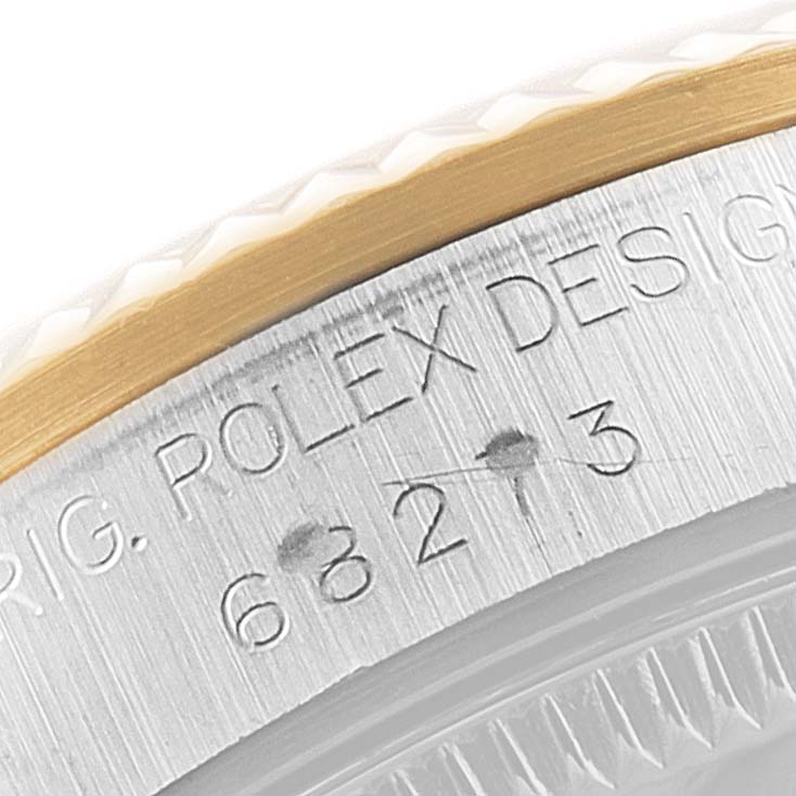 The image shows a close-up of a Mid-Size Rolex watch, focusing on the engraved model number and part of the bezel.
