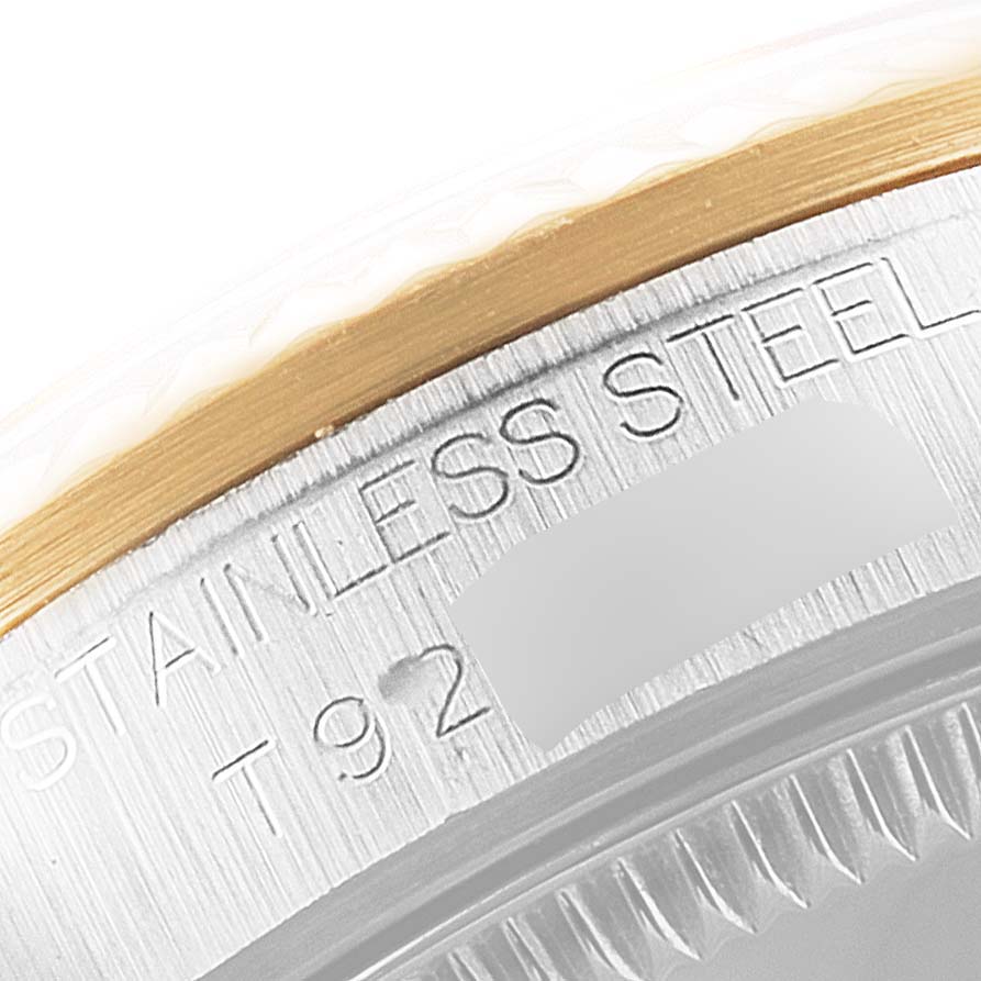 This image shows a close-up of the engraved stainless steel case side of a Rolex Mid-Size 68273 Women's Steel and Gold (two tone) Mother of Pearl Dial 68273 Women's Steel and Gold (two tone) Mother of Pearl Dial model watch.