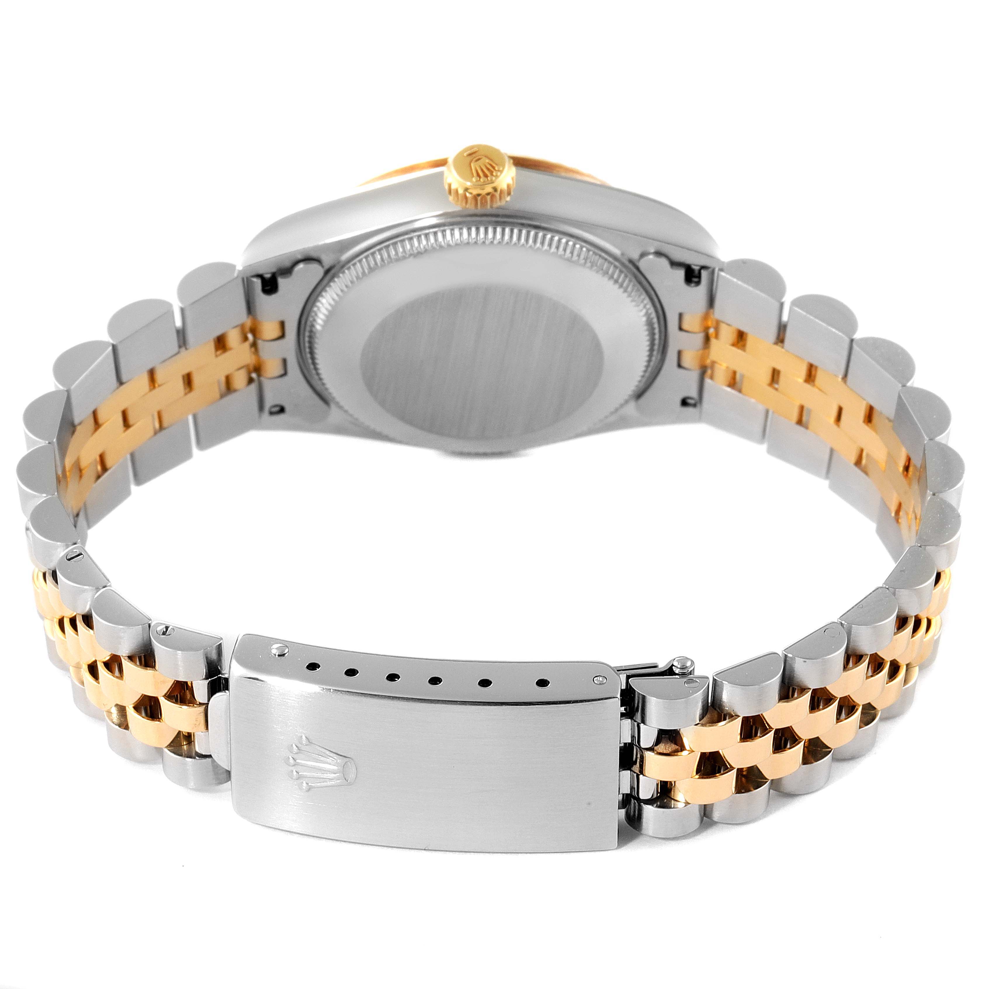 The image shows the back view of a Rolex Mid-Size 68273 Women's Steel and Gold (two tone) Mother of Pearl Dial 68273 Women's Steel and Gold (two tone) Mother of Pearl Dial watch, highlighting the case back, crown, and two-tone bracelet with clasp.