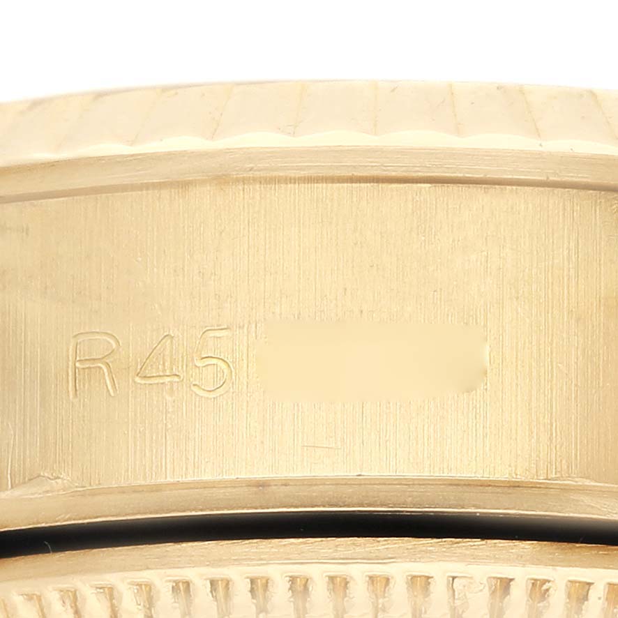 The image shows a close-up of the side of a Rolex President 69178 Women's Yellow Gold White Dial 69178 Women's Yellow Gold White Dial model watch, focusing on the edge details.