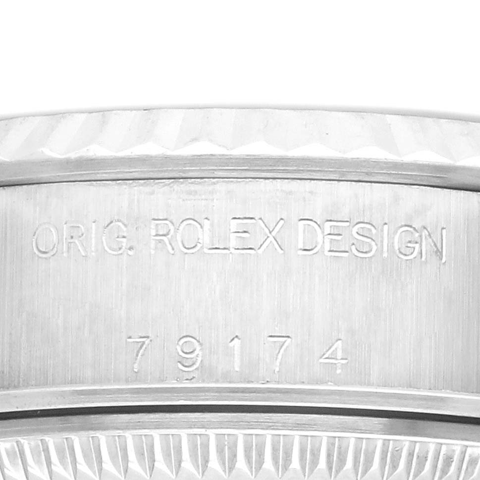 The image shows the side engraving on a Rolex Datejust 79174 Women's Stainless Steel Pink Dial 79174 Women's Stainless Steel Pink Dial, including the model and design numbers.