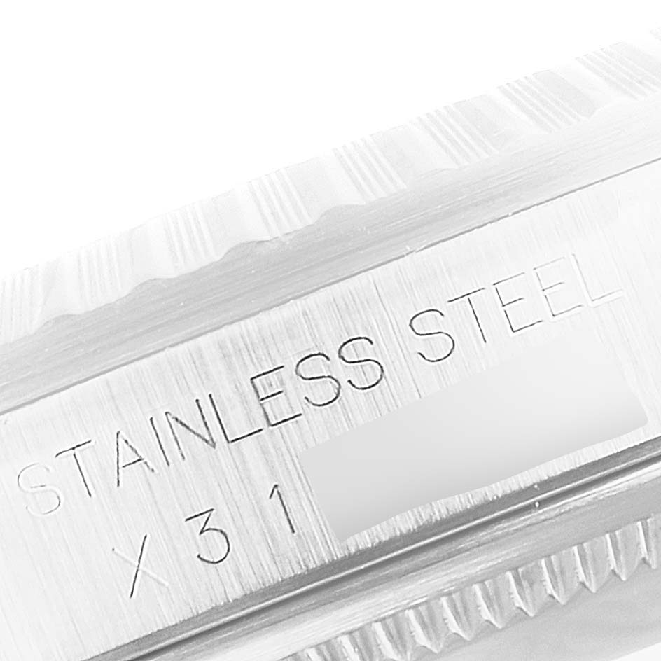 This image shows a close-up angle of the stainless steel case of a Rolex Datejust 16220 Men's Stainless Steel Silver Dial 16220 Men's Stainless Steel Silver Dial watch, highlighting the engraved "STAINLESS STEEL" text.