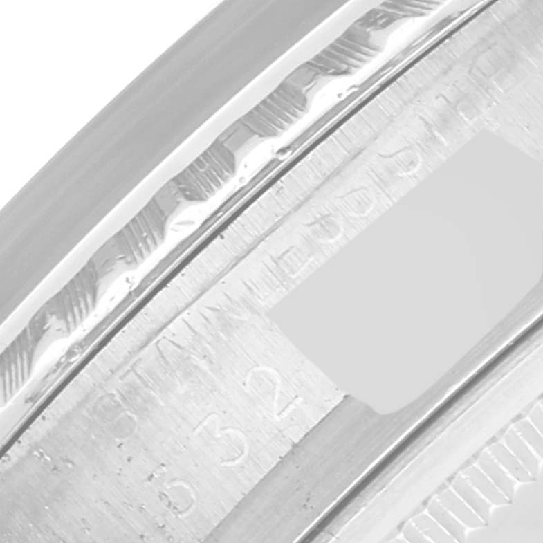 This close-up angle shows the engravings on the case side of the Rolex Vintage Collection 1603 Men's Stainless Steel Silver Dial 1603 Men's Stainless Steel Silver Dial model.