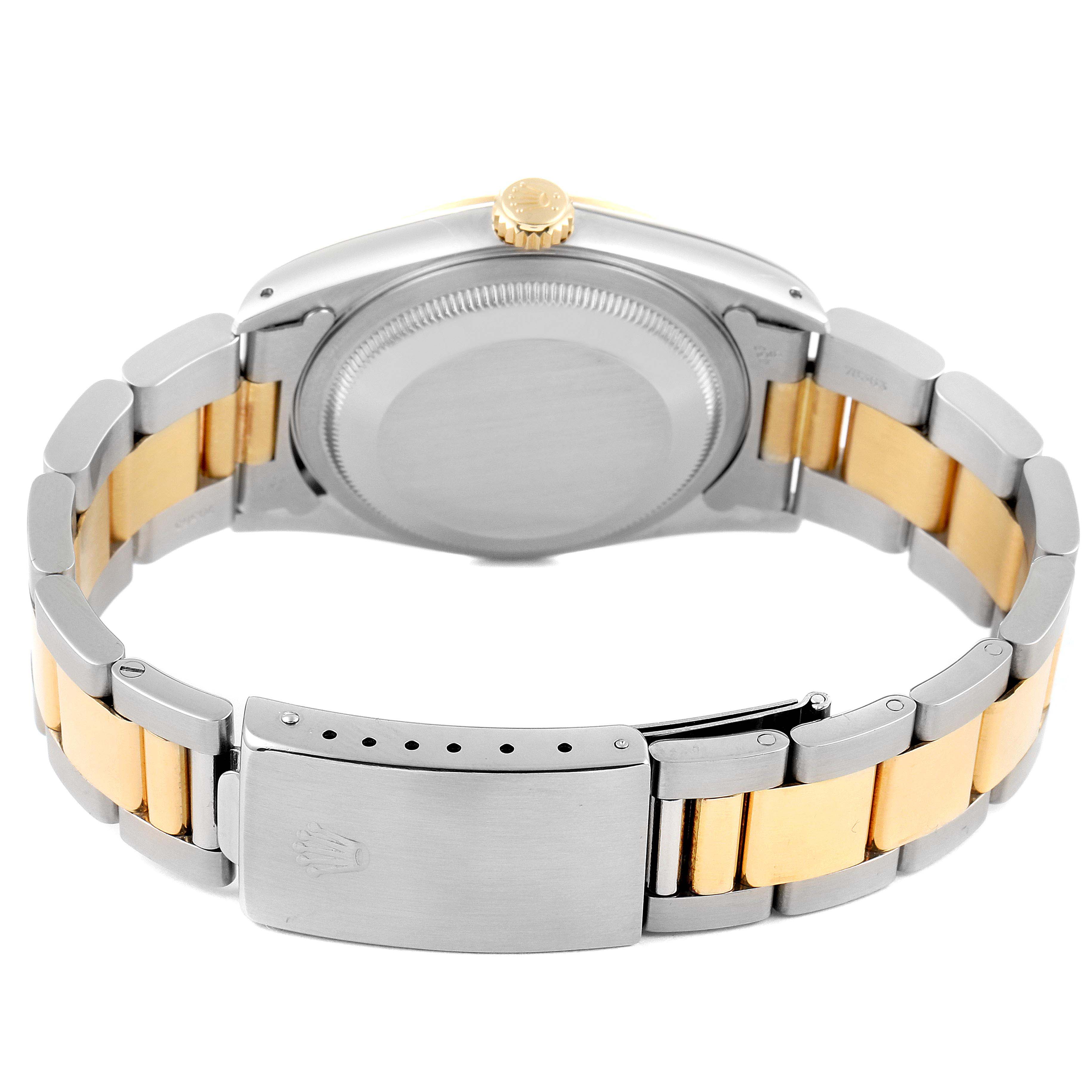 This image shows the back view of a Rolex Datejust 16233 Men's Steel and Gold (two tone) Champagne Dial 16233 Men's Steel and Gold (two tone) Champagne Dial watch, highlighting the metal case, crown, and two-tone bracelet.