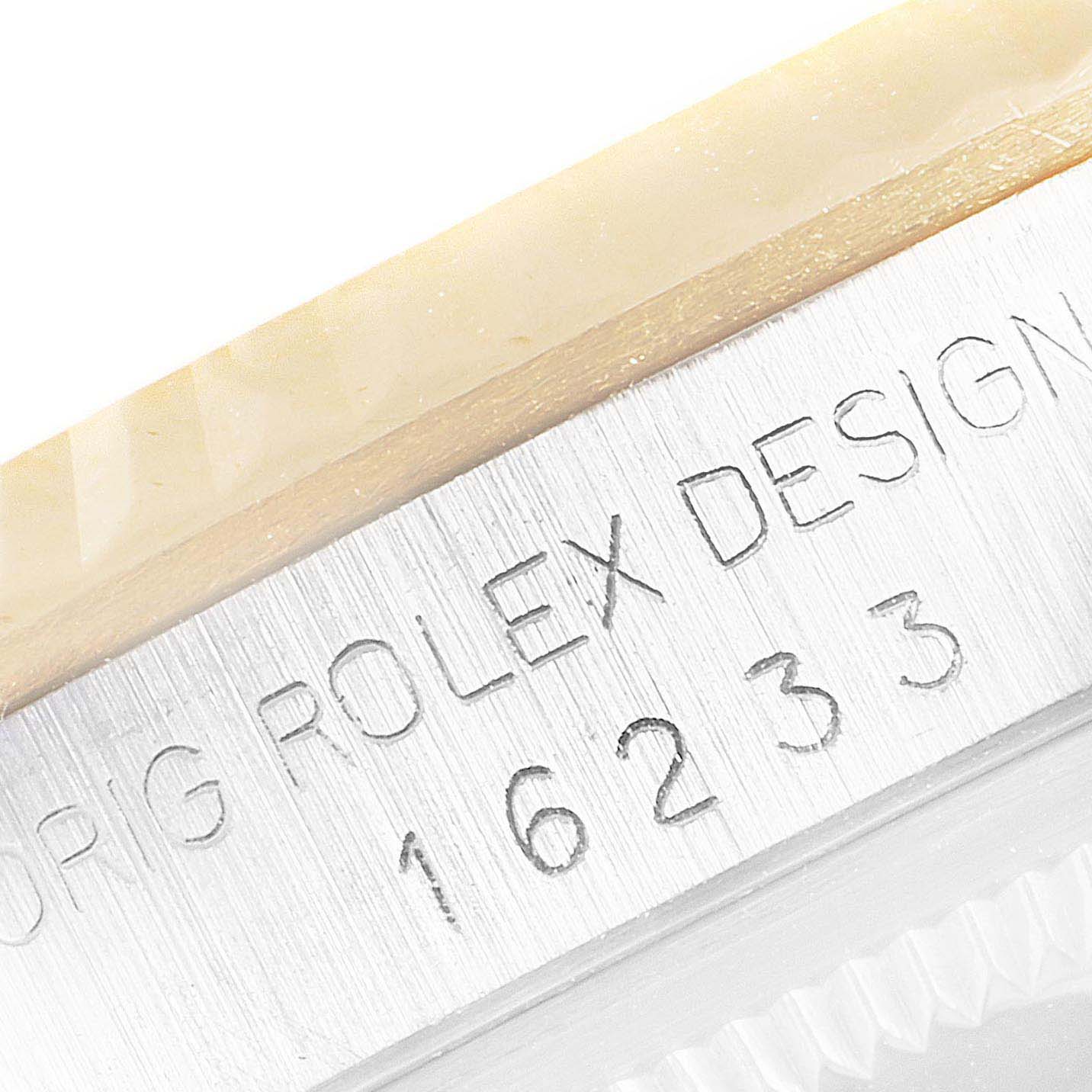 This image shows a close-up of the engraved case side of a Rolex Datejust 16233 Men's Steel and Gold (two tone) Champagne Dial 16233 Men's Steel and Gold (two tone) Champagne Dial model 16233.
