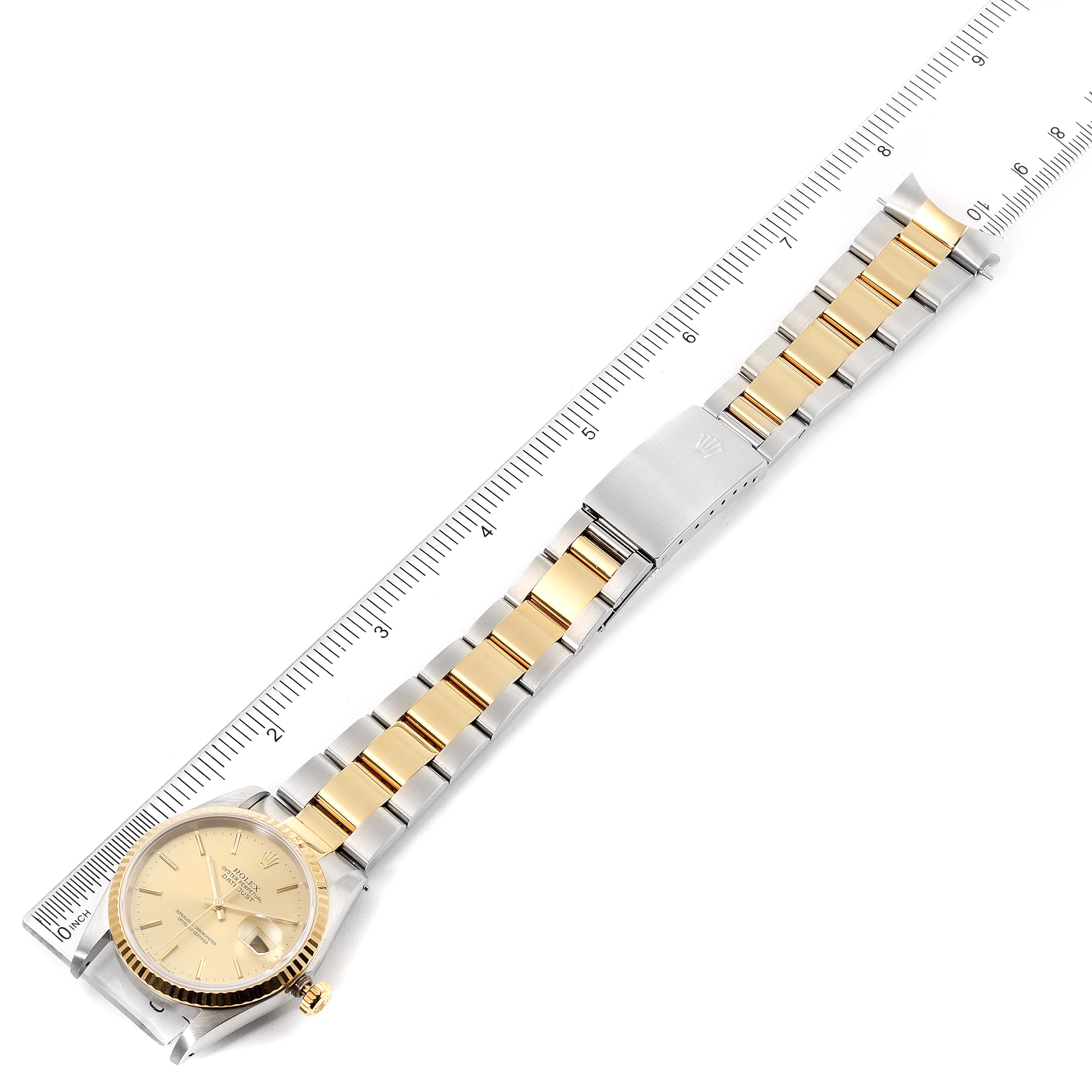 The Rolex Datejust 16233 Men's Steel and Gold (two tone) Champagne Dial 16233 Men's Steel and Gold (two tone) Champagne Dial watch is shown from a top-down angle, displaying the entire band, clasp, and face.