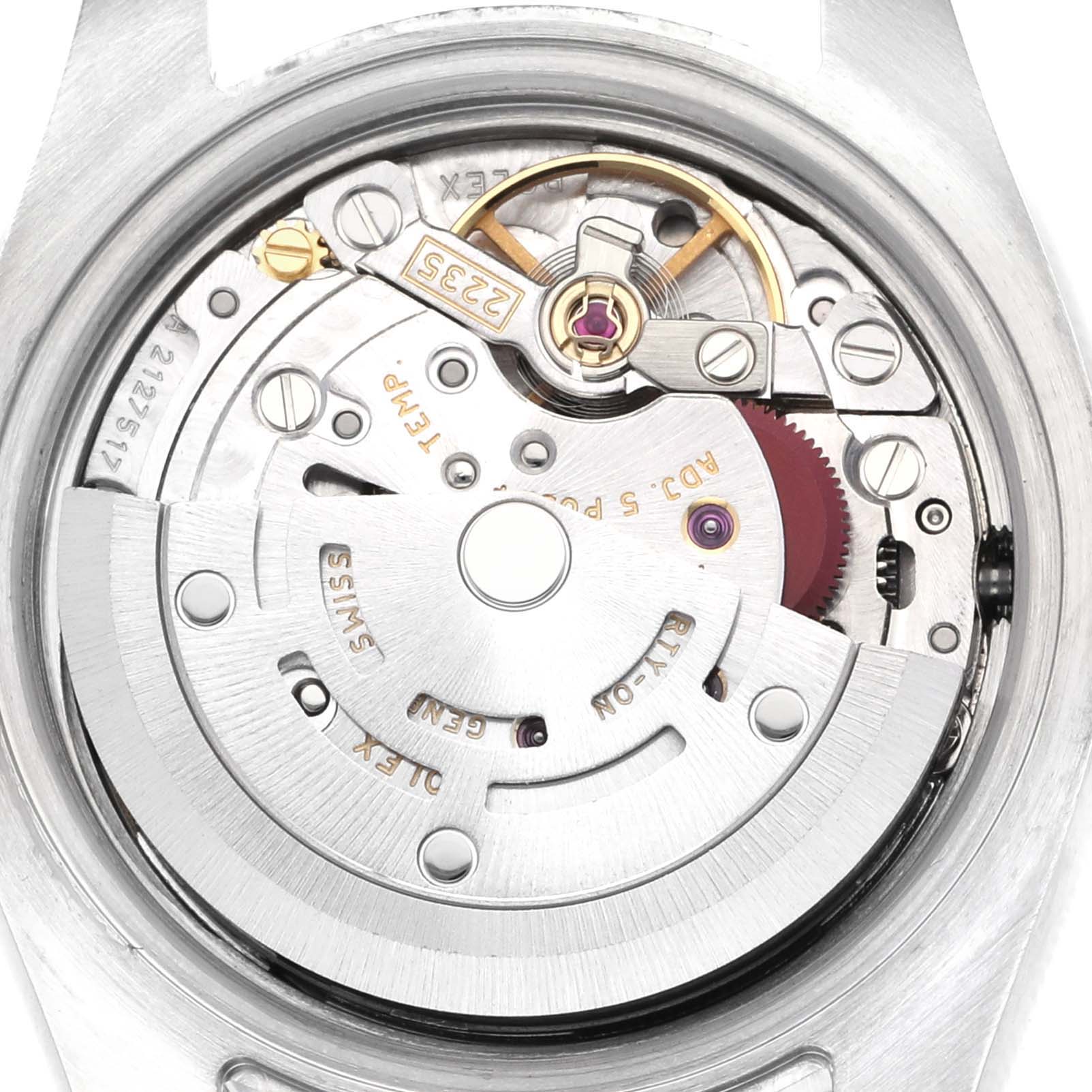 The image shows the movement of a Rolex Datejust 179171 Women's Steel and Gold (two tone) Black Dial 179171 Women's Steel and Gold (two tone) Black Dial watch from a rear angle, highlighting the rotor and mechanical components.