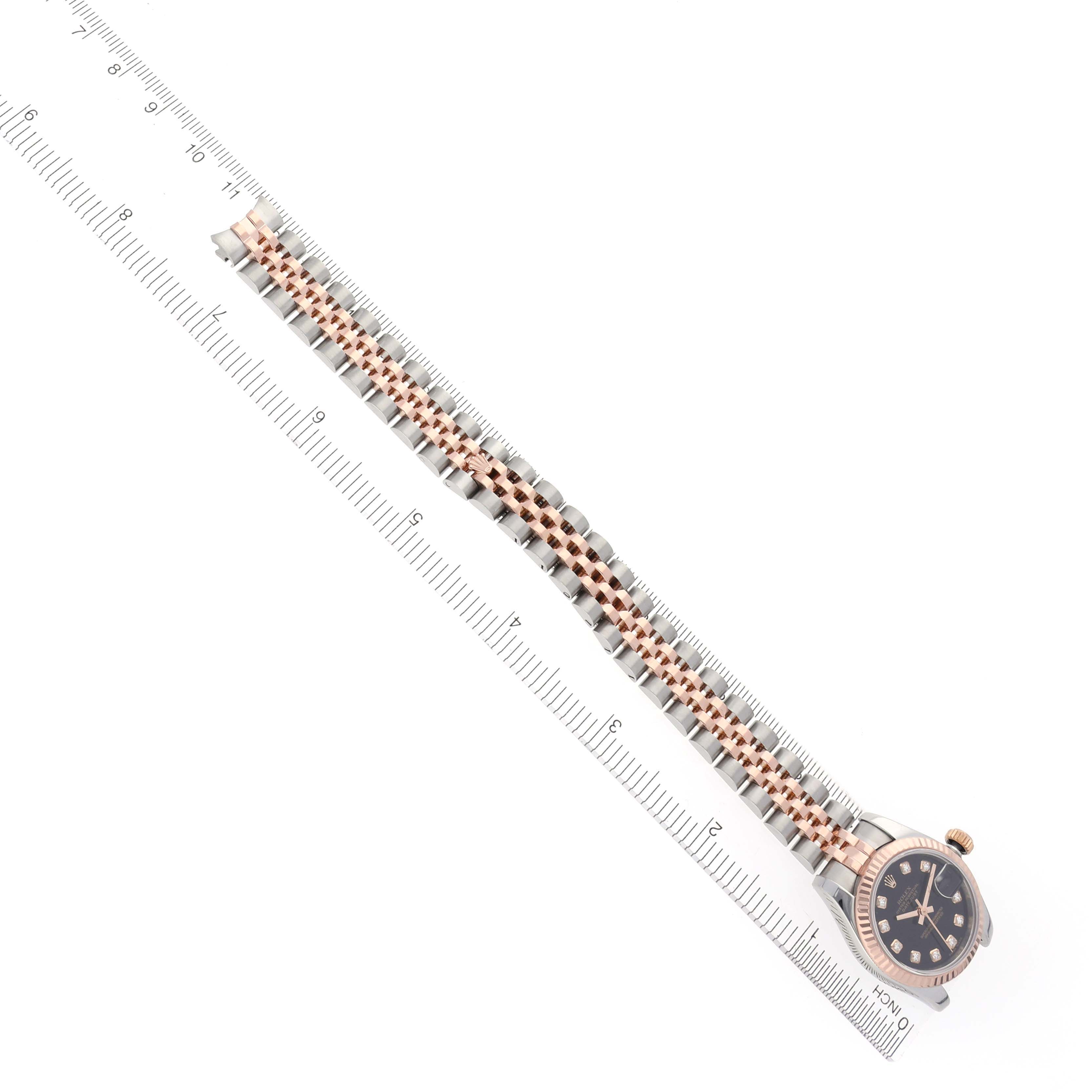 The image shows a Rolex Datejust 179171 Women's Steel and Gold (two tone) Black Dial 179171 Women's Steel and Gold (two tone) Black Dial watch laying flat, highlighting the bracelet and partially visible face.