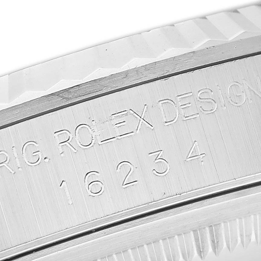 This image shows a close-up of the case back of a Rolex Datejust 16234G Men's Stainless Steel Black Dial 16234G Men's Stainless Steel Black Dial, highlighting the engraved model number.