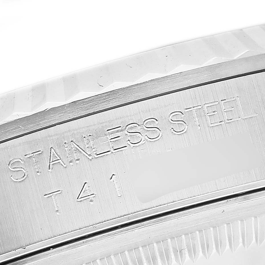 This close-up shows the stainless steel engraving on the case back of the Rolex Datejust 16234G Men's Stainless Steel Black Dial 16234G Men's Stainless Steel Black Dial watch.