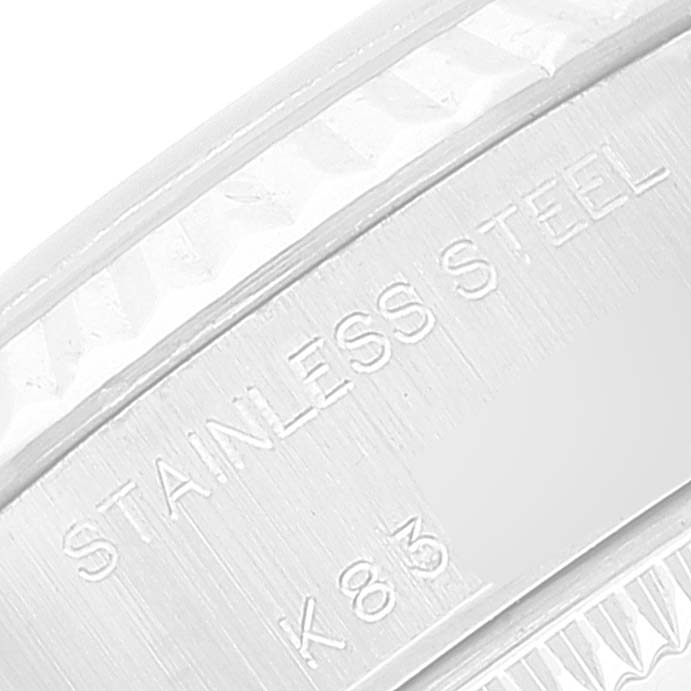 The image shows a close-up angle of the case back edge of a Rolex Datejust 79174 Women's Stainless Steel Blue Dial 79174 Women's Stainless Steel Blue Dial watch, highlighting the "STAINLESS STEEL" marking.