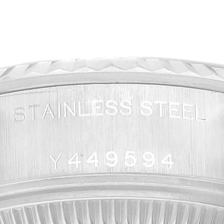 This image shows a close-up of the serial number and "Stainless Steel" engraving on the case of a Rolex Datejust 79174 Women's Stainless Steel Mother of Pearl Dial 79174 Women's Stainless Steel Mother of Pearl Dial watch.
