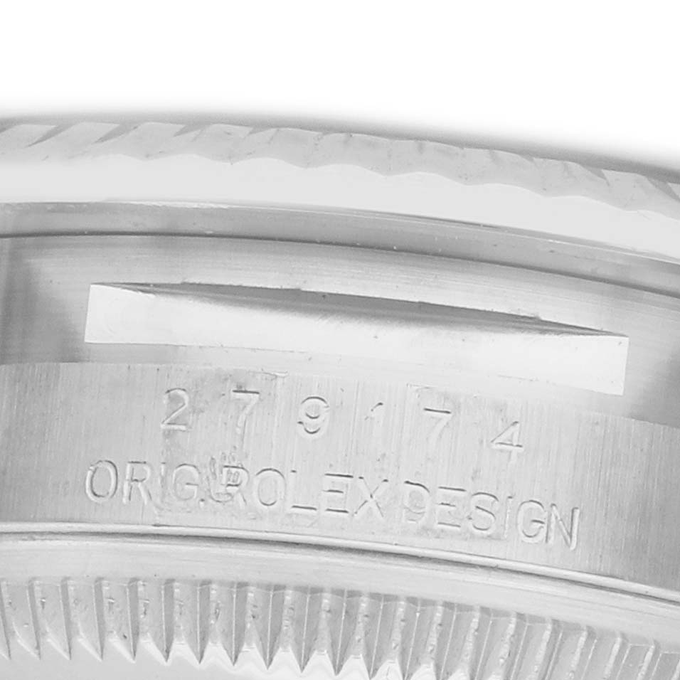 The image shows a close-up of the side of a Rolex Datejust 279174 Women's Stainless Steel Grey Dial watch, focusing on the model number and "ORIG. ROLEX DESIGN" engraving.