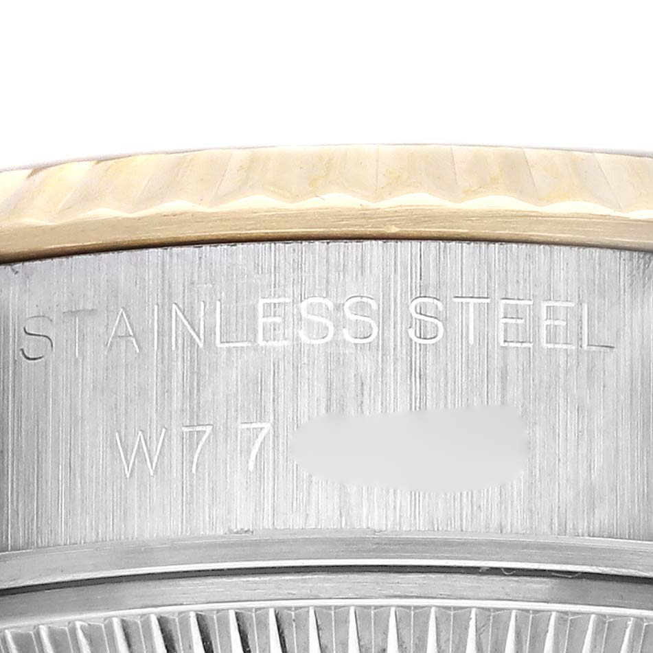 The image shows a close-up of the side bezel with inscriptions on a Rolex Datejust 69173 Women's Steel and Gold (two tone) Champagne Dial 69173 Women's Steel and Gold (two tone) Champagne Dial watch.