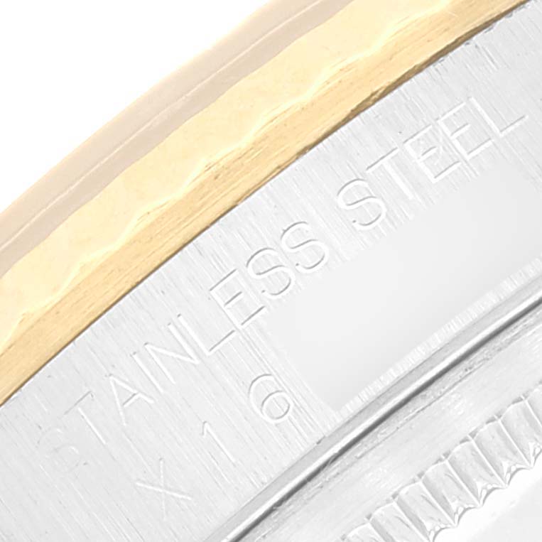 This image shows a close-up of the casing of a Rolex Datejust 16233 Men's Steel and Gold (two tone) Beige Dial 16233 Men's Steel and Gold (two tone) Beige Dial watch, highlighting the stainless steel and gold components.